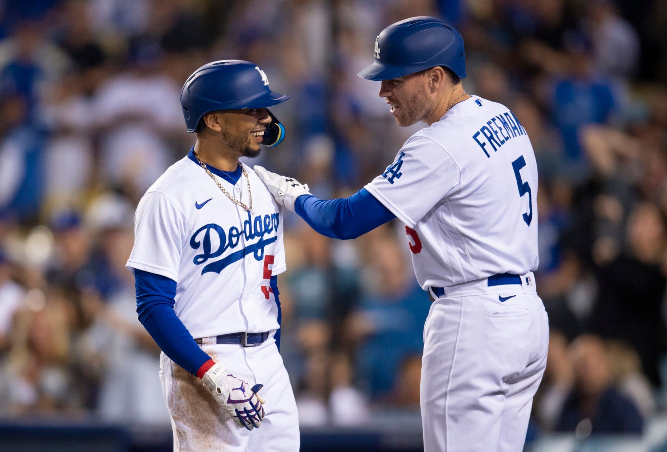 LOS ANGELES, CA - JULY 07: Los Angeles Dodgers Mookie Betts (50) is congratulated by Freddie Freeman (5) after hitting a home run against Chicago Cubs relief pitcher Scott Effross (57) at Dodger Stadium on July 7, 2022 in Los Angeles, CA. (Photo by John McCoy/Icon Sportswire via Getty Images)