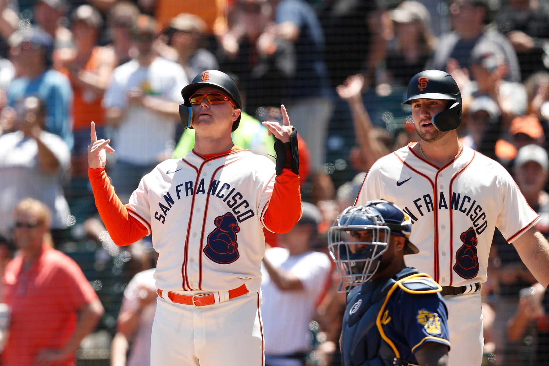 SAN FRANCISCO, CALIFORNIA - JULY 17: Joc Pederson #23 and Joey Bart #21 of the San Francisco Giants celebrates after scoring on a three-run home run by LaMonte Wade Jr. #31 in the bottom of the third inning against the Milwaukee Brewers at Oracle Park on July 17, 2022 in San Francisco, California. (Photo by Lachlan Cunningham/Getty Images)