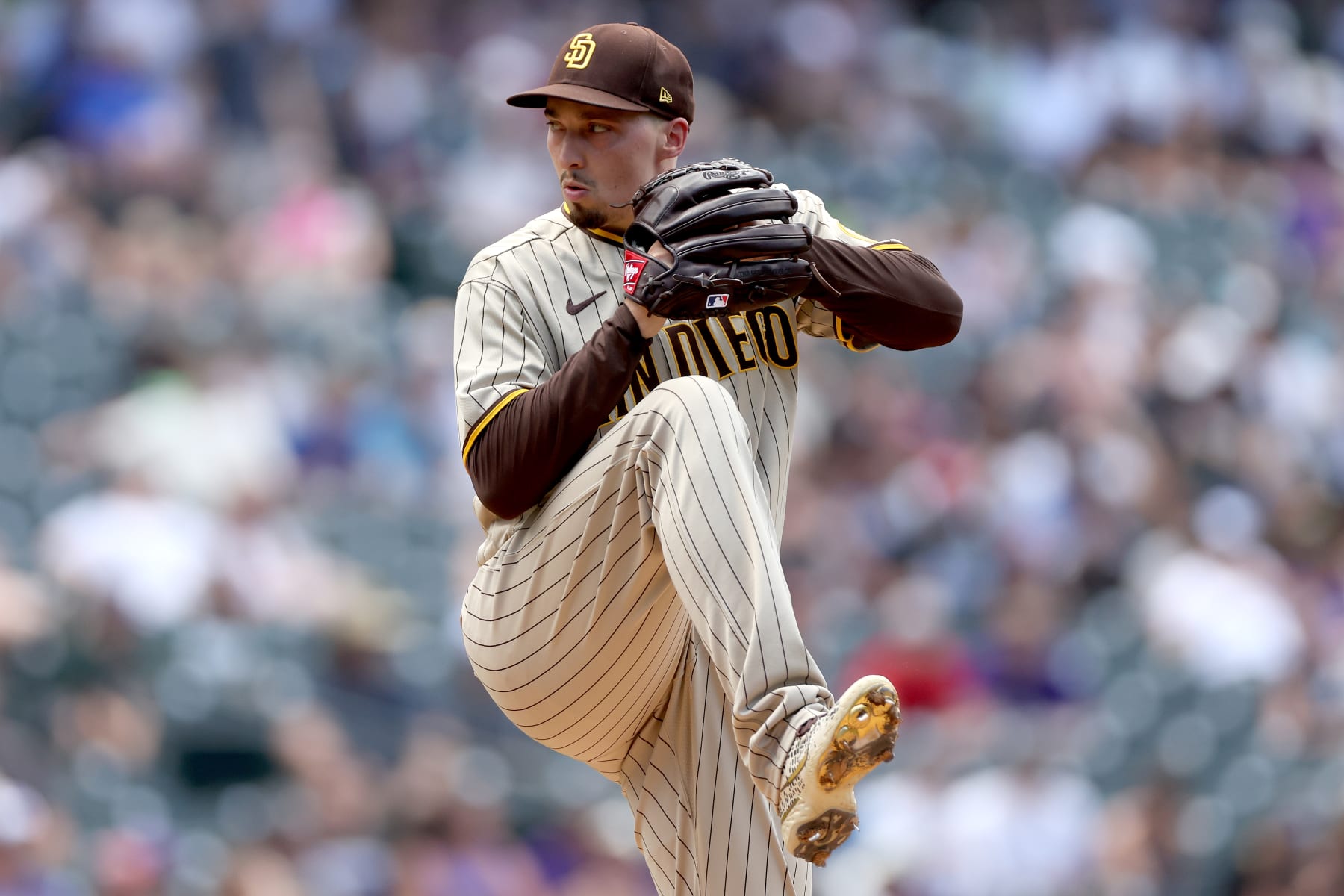 DENVER, COLORADO - JULY 14: Starting pitcher Blake Snell #4 of the San Diego Padres throws against the Colorado Rockies in the first inning at Coors Field on July 14, 2022 in Denver, Colorado. (Photo by Matthew Stockman/Getty Images)