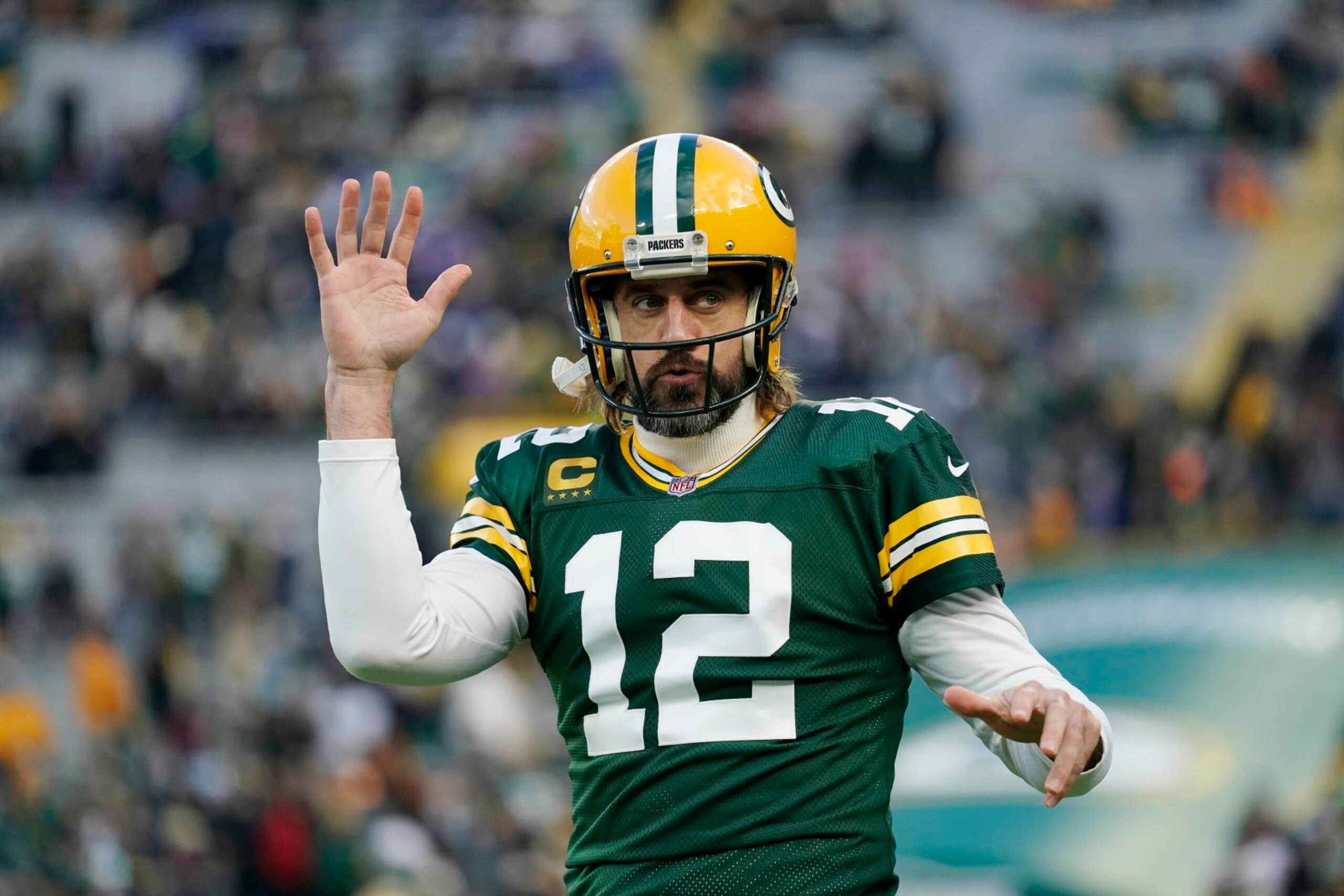 GREEN BAY, WISCONSIN - NOVEMBER 28: Aaron Rodgers #12 of the Green Bay Packers looks on during pregame warm-ups before the game against the Los Angeles Rams at Lambeau Field on November 28, 2021 in Green Bay, Wisconsin. (Photo by Patrick McDermott/Getty Images)