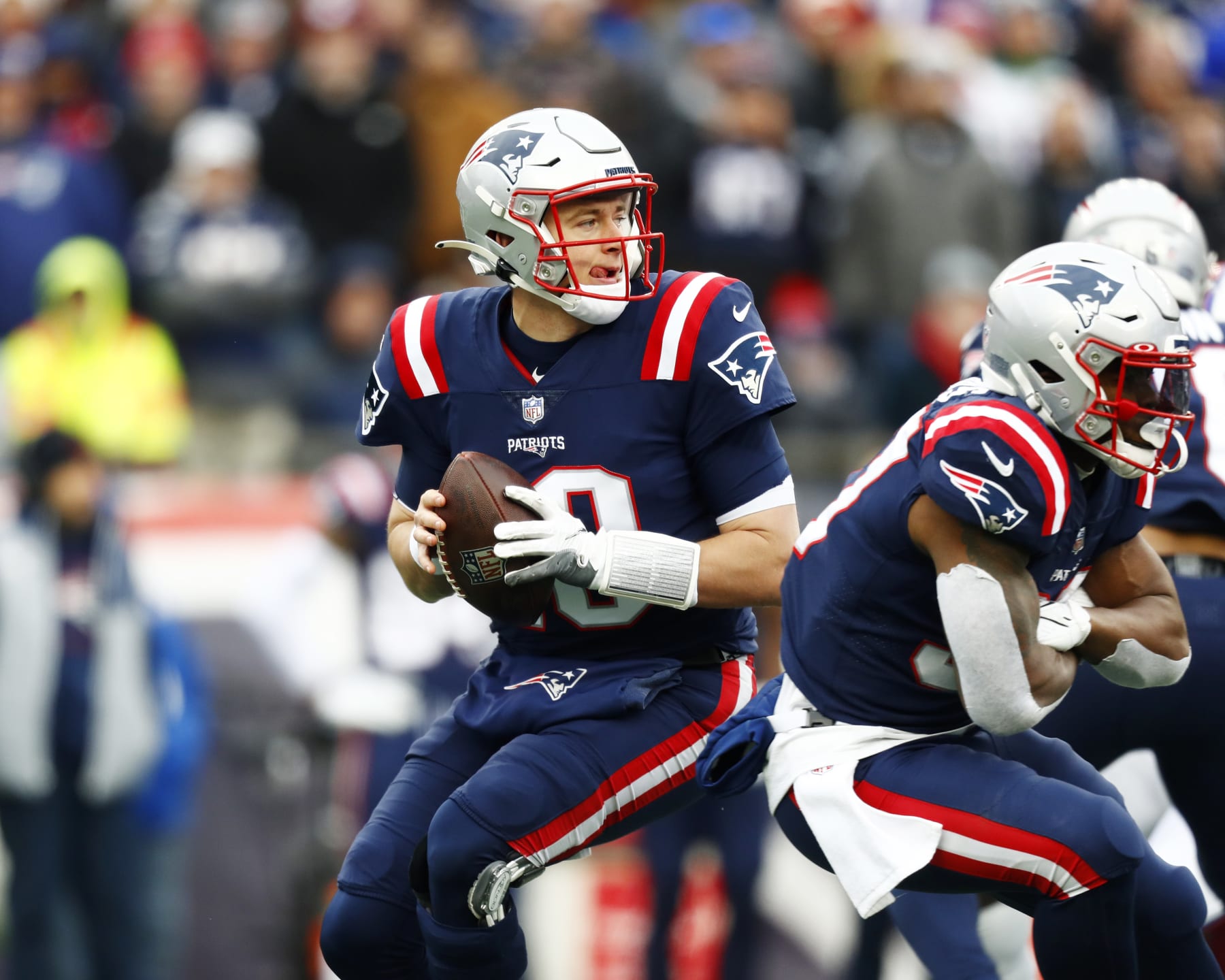 FOXBOROUGH, MASSACHUSETTS - DECEMBER 26: Quarterback  Mac Jones #10 of the New England Patriots looks to pass during the second quarter of the game against the Buffalo Bills at Gillette Stadium on December 26, 2021 in Foxborough, Massachusetts. (Photo by Omar Rawlings/Getty Images)