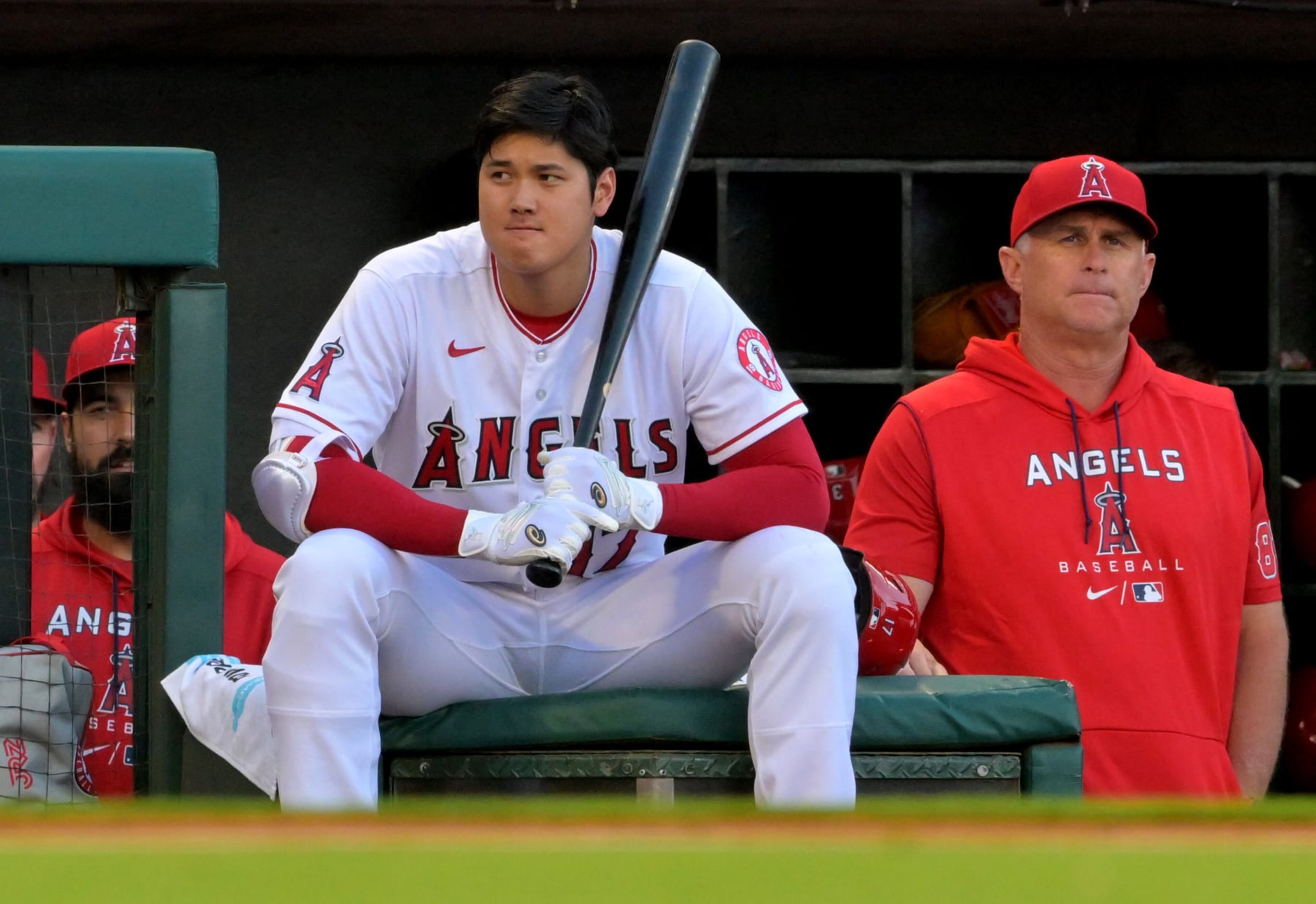ANAHEIM, CA - JULY 12: Shohei Ohtani #17 of the Los Angeles Angels and interim manager Phil Nevin #88 look on from the dugout during the game against the Houston Astros at Angel Stadium of Anaheim on July 12, 2022 in Anaheim, California. (Photo by Jayne Kamin-Oncea/Getty Images) ANAHEIM, CA - JULY 12: Shohei Ohtani #17 of the Los Angeles Angels and interim manager Phil Nevin #88 look on from the dugout during the game against the Houston Astros at Angel Stadium of Anaheim on July 12, 2022 in Anaheim, California. (Photo by Jayne Kamin-Oncea/Getty Images)