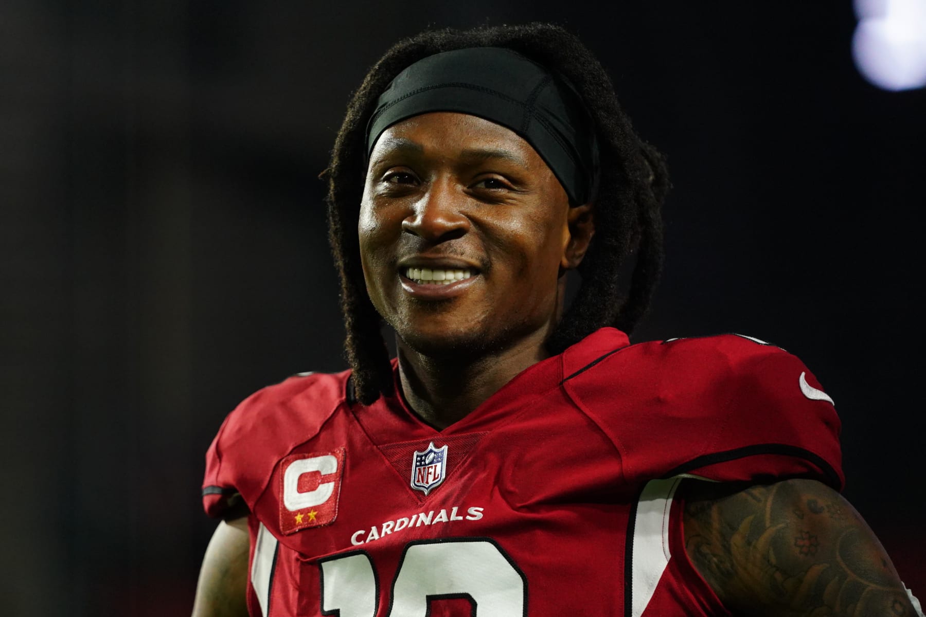 GLENDALE, ARIZONA - DECEMBER 13: DeAndre Hopkins #10 of the Arizona Cardinals warms up against the Los Angeles Rams prior to an NFL game at State Farm Stadium on December 13, 2021 in Glendale, Arizona. (Photo by Cooper Neill/Getty Images)