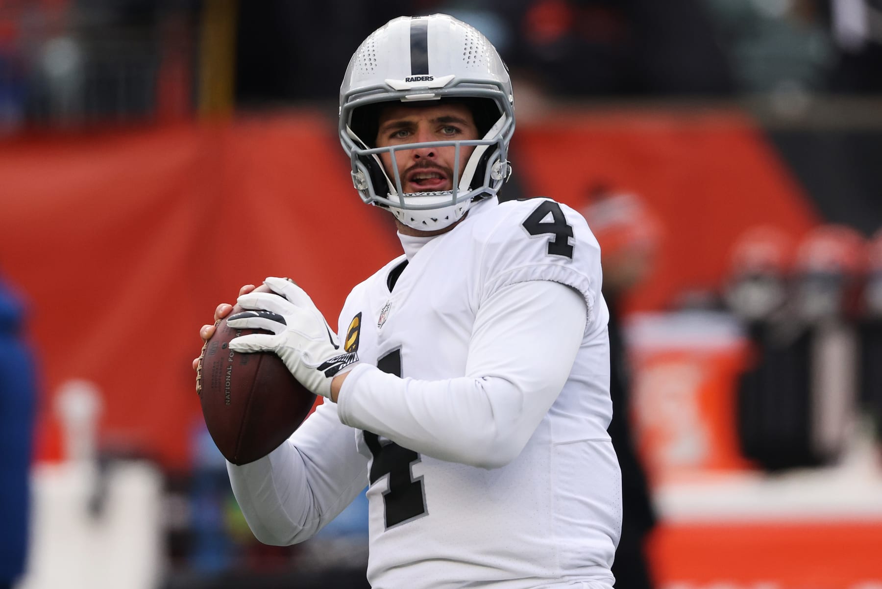 CINCINNATI, OHIO - JANUARY 15: Quarterback Derek Carr #4 of the Las Vegas Raiders warms up before the start of the AFC Wild Card playoff game against the Cincinnati Bengals at Paul Brown Stadium on January 15, 2022 in Cincinnati, Ohio. (Photo by Dylan Buell/Getty Images)