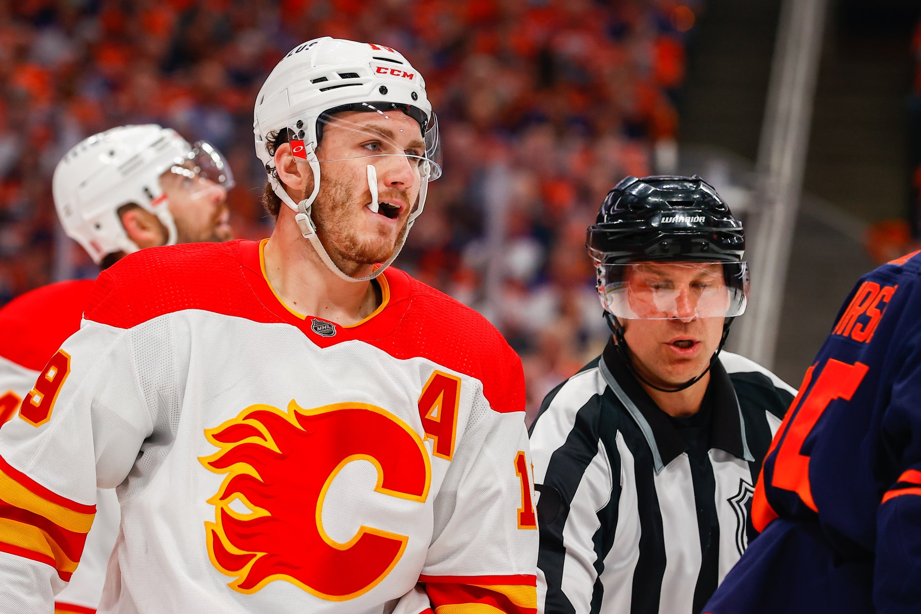 EDMONTON, AB - MAY 24: Calgary Flames Right Wing Matthew Tkachuk (19) gets pulled out of scrum action in the first period during the Edmonton Oilers versus the Calgary Flames in the Stanley Cup playoffs round 2, game 4 on May 24, 2022 at Rogers Place in Edmonton, AB. (Photo by Curtis Comeau/Icon Sportswire via Getty Images)