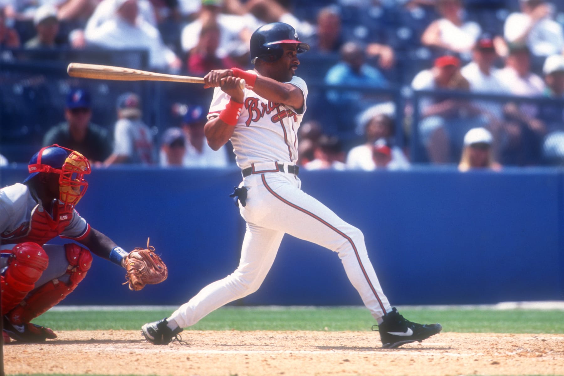 ATLANTA, GA - JULY 16:  Dwight Smith #7 of the Atlanta Braves takes a swing during a baseball game against the Montreal Expos on July 16, 1996 at Fulton County Stadium in Atlanta, Georgia.  (Photo by Mitchell Layton/Getty Images)