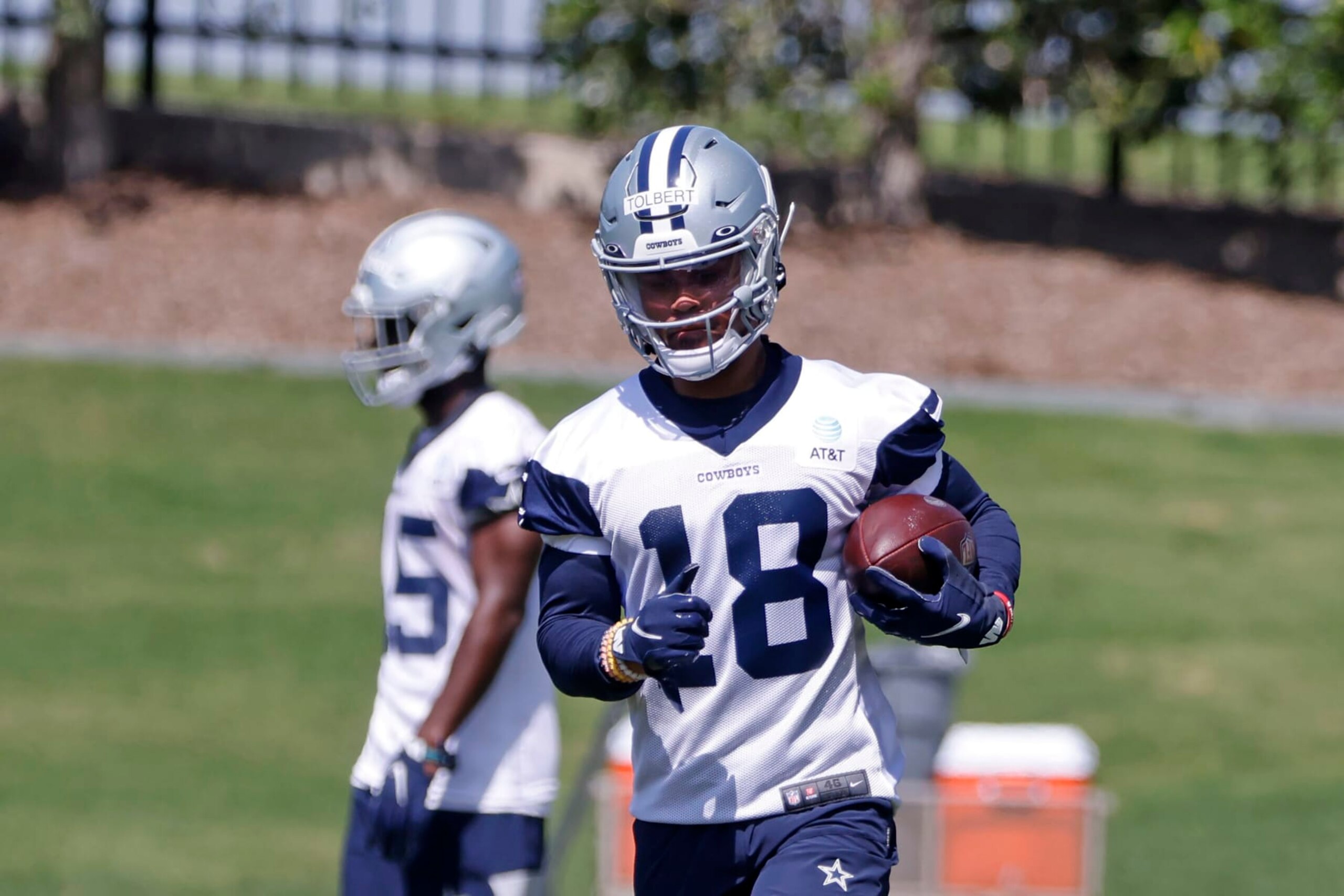 Dallas Cowboys wide receiver Jalen Tolbert (18) runs with the ball after a reception, during the NFL football team's rookie minicamp in Frisco, Texas, Friday, May 13, 2022. (AP Photo/Michael Ainsworth) Dallas Cowboys wide receiver Jalen Tolbert (18) runs with the ball after a reception, during the NFL football team's rookie minicamp in Frisco, Texas, Friday, May 13, 2022. (AP Photo/Michael Ainsworth)