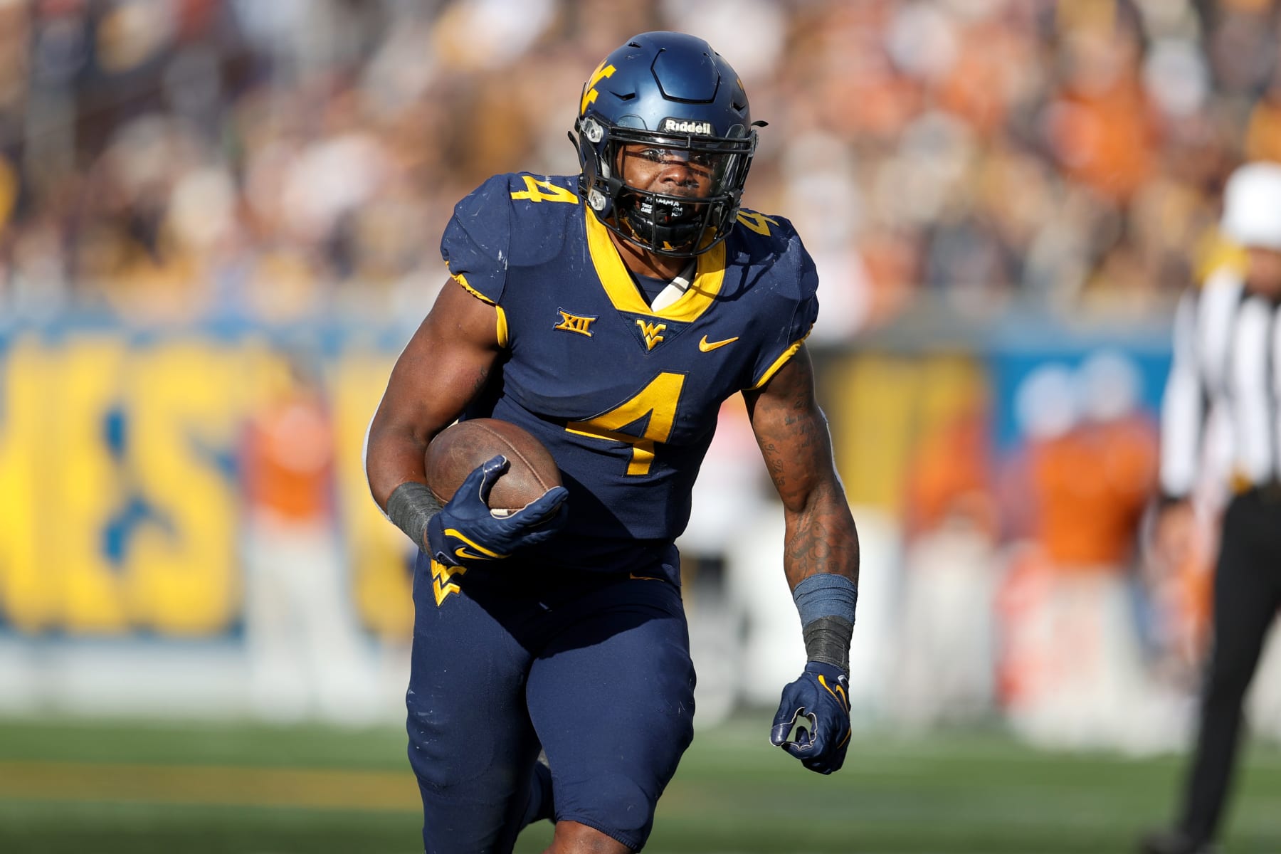 MORGANTOWN, WV - NOVEMBER 20: West Virginia Mountaineers running back Leddie Brown (4) carries the football during the third quarter of the college football game between the Texas Longhorns and the West Virginia Mountaineers on November 20, 2021, at Mountaineer Field at Milan Puskar Stadium in Morgantown, WV. (Photo by Frank Jansky/Icon Sportswire via Getty Images)