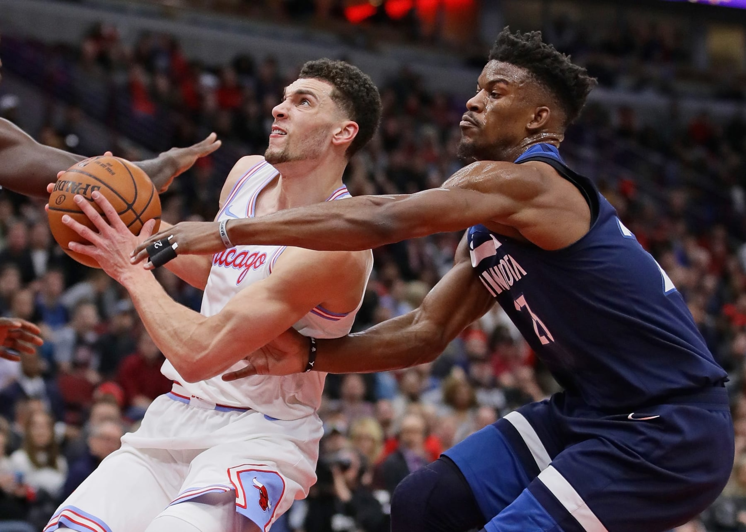 CHICAGO, IL - FEBRUARY 09:  Zach LaVine #8 of the Chicago Bulls drives past Jimmy Butler #23 of the Minnesota Timberwolves at the United Center on February 9, 2018 in Chicago, Illinois. NOTE TO USER: User expressly acknowledges and agrees that, by downloading and or using this photograph, User is consenting to the terms and conditions of the Getty Images License Agreement. (Photo by Jonathan Daniel/Getty Images)