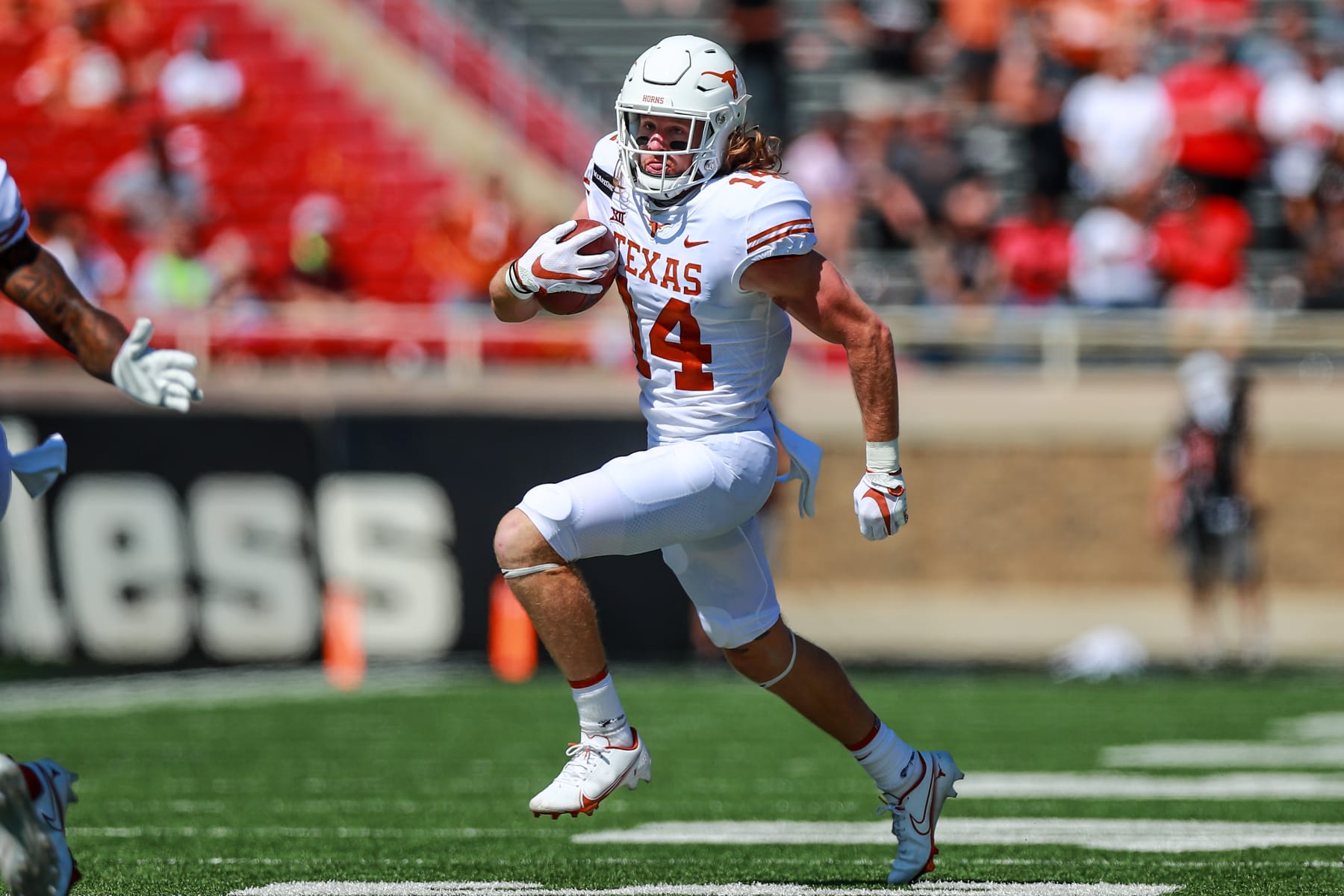 LUBBOCK, TEXAS - SEPTEMBER 26: Receiver Brenden Schooler #14 of the Texas Longhorns runs the ball during the first half of the college football game against the Texas Tech Red Raiders on September 26, 2020 at Jones AT&T Stadium in Lubbock, Texas. (Photo by John E. Moore III/Getty Images)