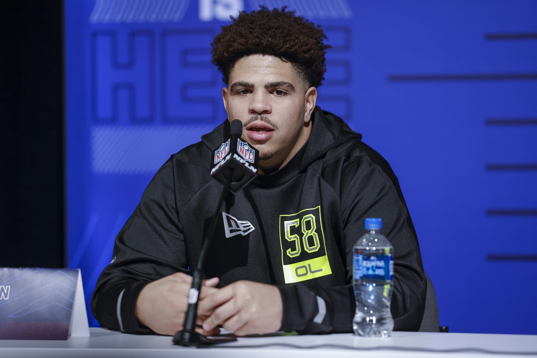 INDIANAPOLIS, IN - MAR 03: Dohnovan West #OL58 of the Arizona State Sun Devils speaks to reporters during the NFL Draft Combine at the Indiana Convention Center on March 3, 2022 in Indianapolis, Indiana. (Photo by Michael Hickey/Getty Images)