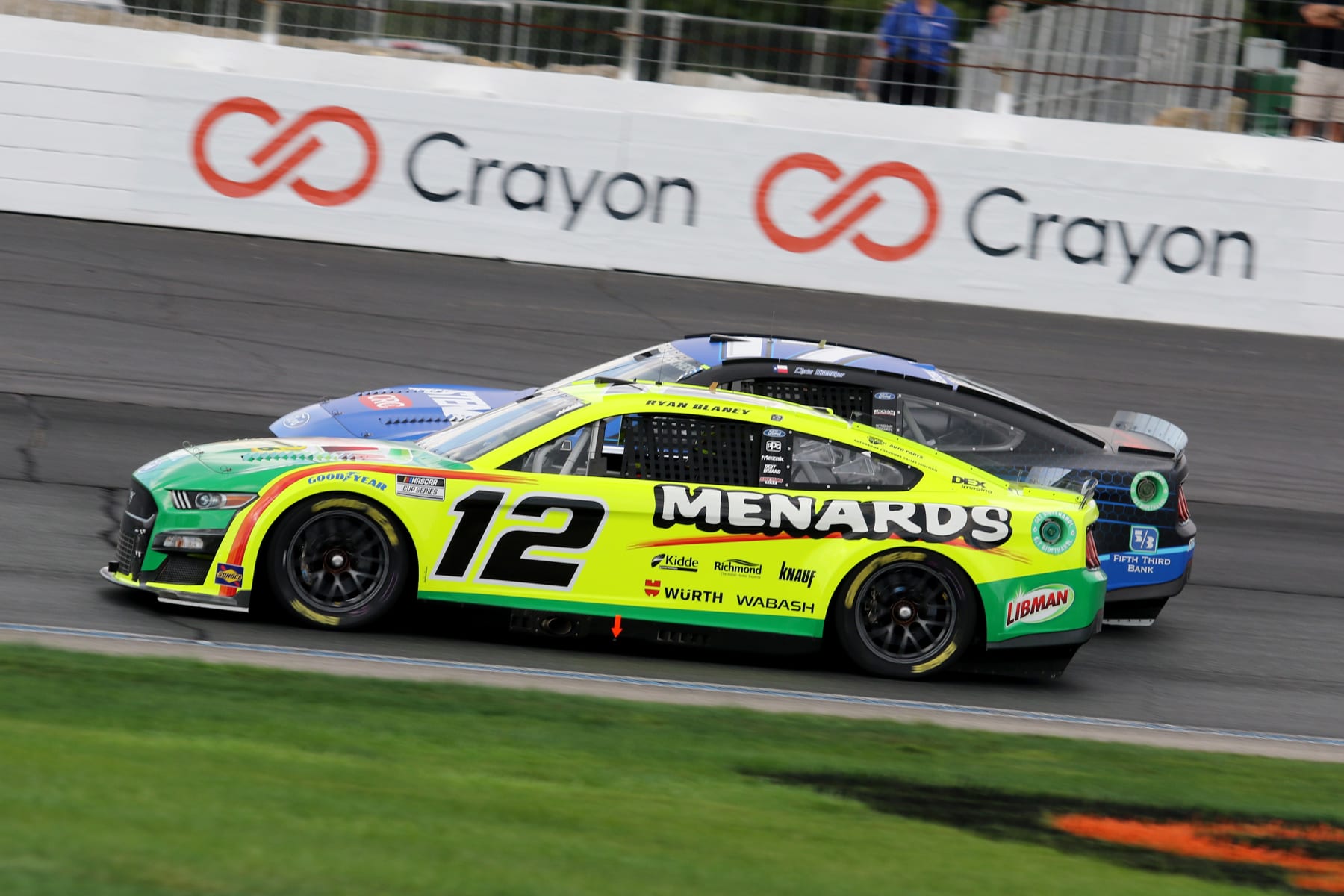 LOUDON, NH - JULY 17: Ryan Blaney (#12 Team Penske Menards/Libman Ford) and Chris Buescher (#17 RFK Racing Fastenal Ford)  in turn 4 during the NASCAR Cup Series Ambetter 301  race on July 17, 2022 at the New Hampshire Motor Speedway in Loudon, New Hampshire. (Photo by Malcolm Hope/Icon Sportswire via Getty Images)