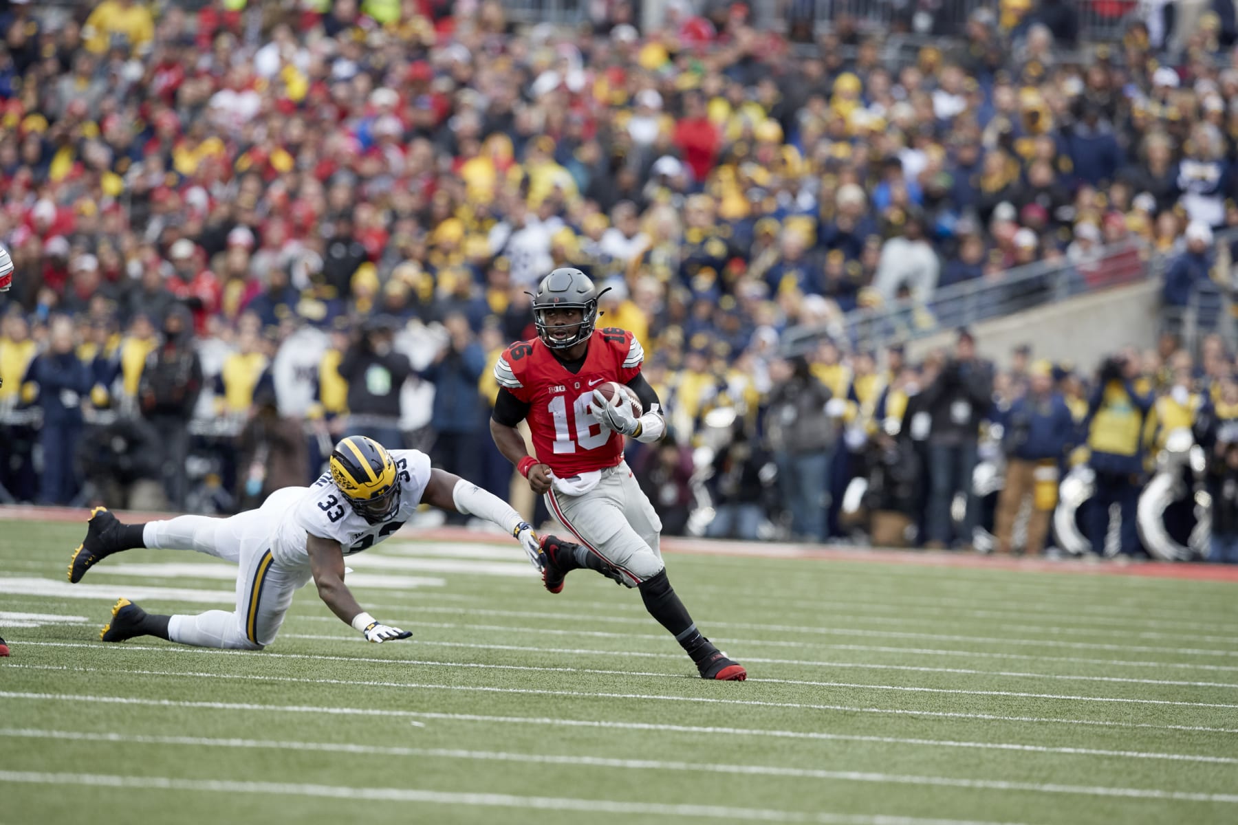 College Football: Ohio State QB J.T. Barrett (16) in action vs Michigan Taco Charlton (33) at Ohio Stadium.
Columbus, OH 11/26/2016
CREDIT: Jeff Haynes (Photo by Jeff Haynes /Sports Illustrated via Getty Images)
(Set Number: SI628 TK1 )