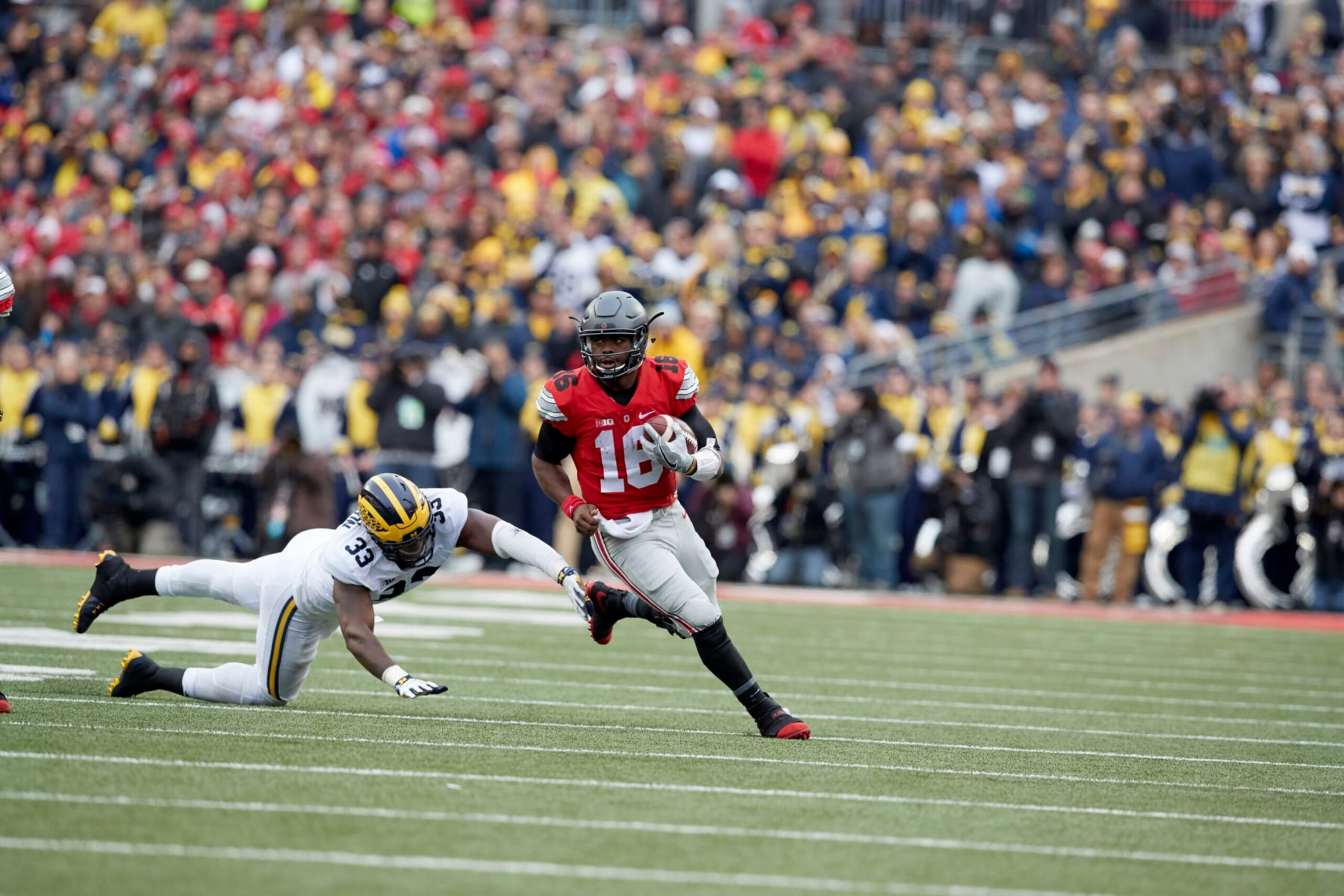 College Football: Ohio State QB J.T. Barrett (16) in action vs Michigan Taco Charlton (33) at Ohio Stadium.
Columbus, OH 11/26/2016
CREDIT: Jeff Haynes (Photo by Jeff Haynes /Sports Illustrated via Getty Images)
(Set Number: SI628 TK1 )