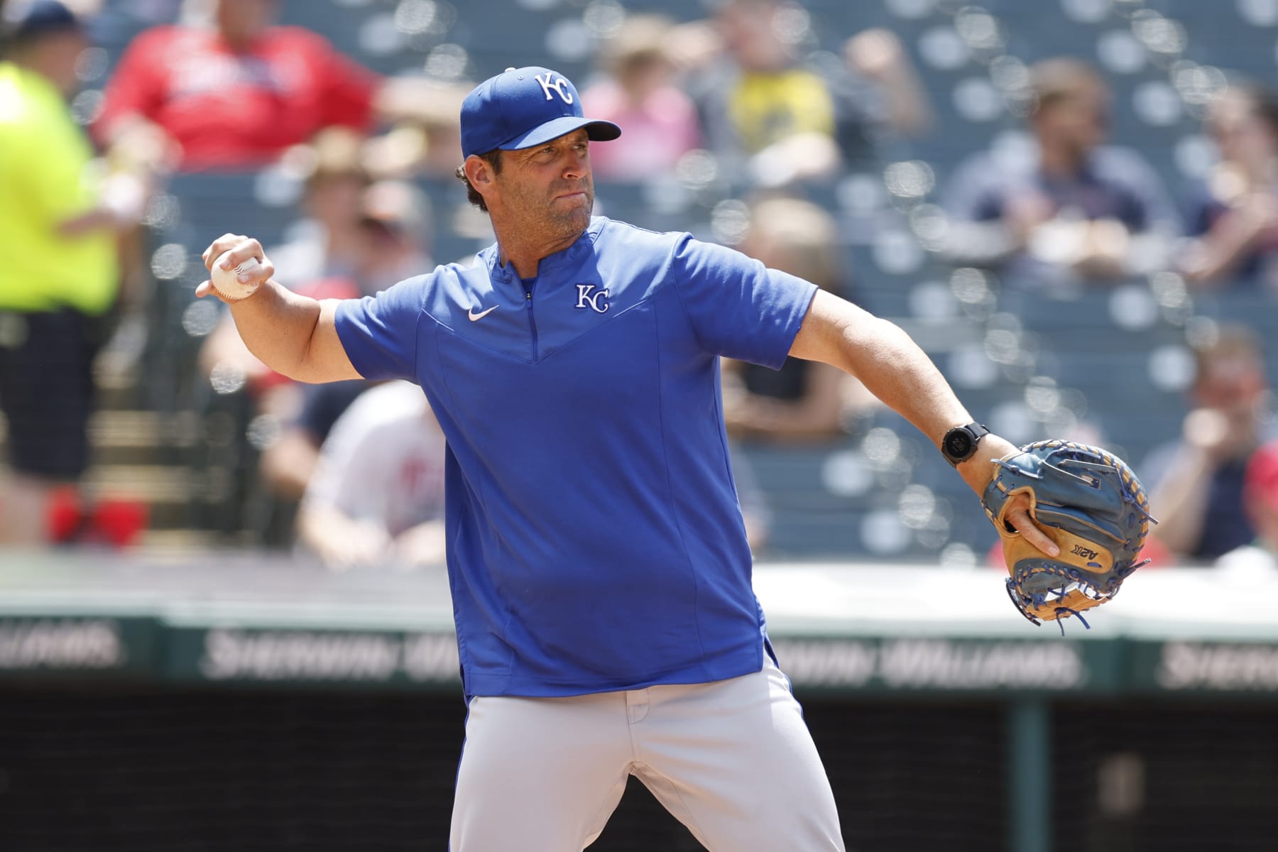 CLEVELAND, OH - JUNE 01: Manager Mike Matheny #22 of the Kansas City Royals warms up his pitcher during the fifth inning against the Cleveland Guardians at Progressive Field on June 01, 2022 in Cleveland, Ohio. (Photo by Ron Schwane/Getty Images)