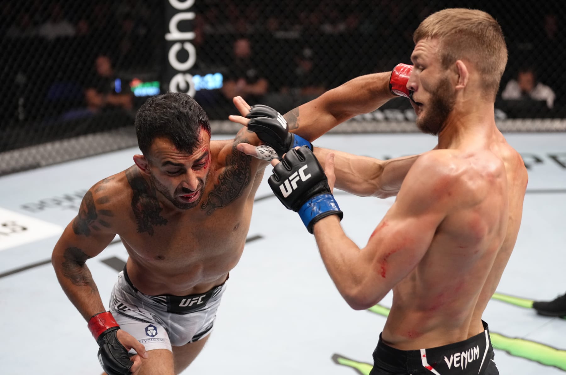 LONDON, ENGLAND - JULY 23: (L-R) Makwan Amirkhani of Kurdistan punches Jonathan Pearce in a featherweight fight during the UFC Fight Night event at O2 Arena on July 23, 2022 in London, England. (Photo by Jeff Bottari/Zuffa LLC)