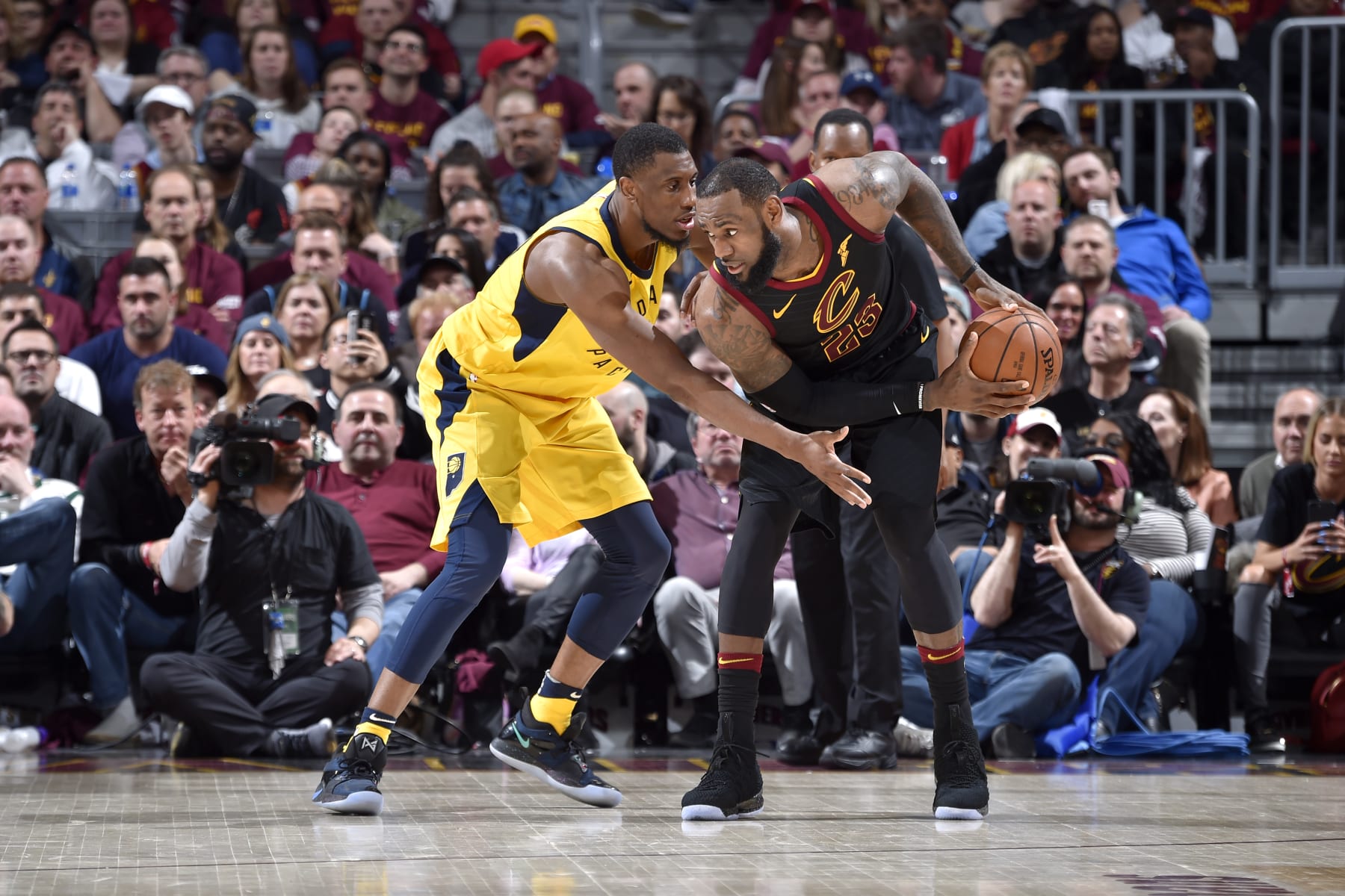 CLEVELAND, OH - APRIL 25: LeBron James #23 of the Cleveland Cavaliers handles the ball against Thaddeus Young #21 of the Indiana Pacers in Game Five of Round One of the 2018 NBA Playoffs between the Indiana Pacers and Cleveland Cavaliers on April 25, 2018 at Quicken Loans Arena in Cleveland, Ohio. NOTE TO USER: User expressly acknowledges and agrees that, by downloading and/or using this Photograph, user is consenting to the terms and conditions of the Getty Images License Agreement. Mandatory Copyright Notice: Copyright 2018 NBAE  (Photo by David Liam Kyle/NBAE via Getty Images)