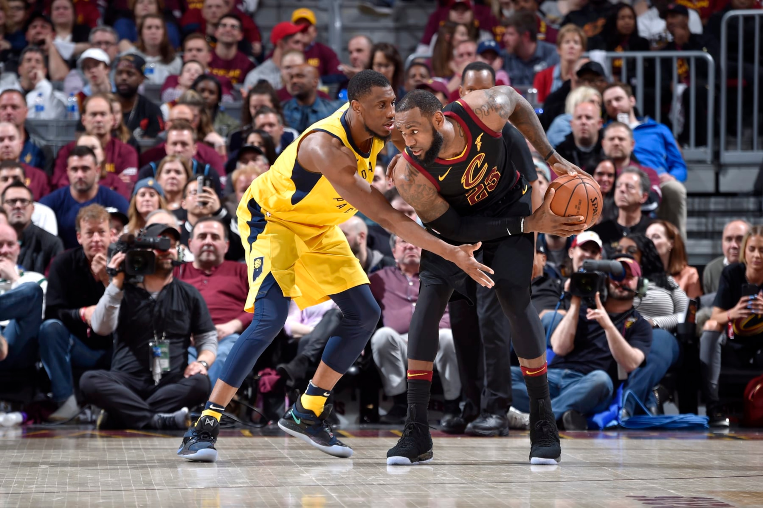 CLEVELAND, OH - APRIL 25: LeBron James #23 of the Cleveland Cavaliers handles the ball against Thaddeus Young #21 of the Indiana Pacers in Game Five of Round One of the 2018 NBA Playoffs between the Indiana Pacers and Cleveland Cavaliers on April 25, 2018 at Quicken Loans Arena in Cleveland, Ohio. NOTE TO USER: User expressly acknowledges and agrees that, by downloading and/or using this Photograph, user is consenting to the terms and conditions of the Getty Images License Agreement. Mandatory Copyright Notice: Copyright 2018 NBAE  (Photo by David Liam Kyle/NBAE via Getty Images)