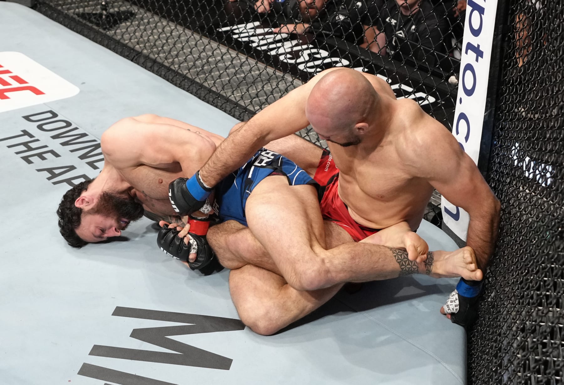 LONDON, ENGLAND - JULY 23: (L-R) Paul Craig of Scotland works for a leg lock against Volkan Oezdemir of Switzerland in a light heavyweight fight during the UFC Fight Night event at O2 Arena on July 23, 2022 in London, England. (Photo by Jeff Bottari/Zuffa LLC)