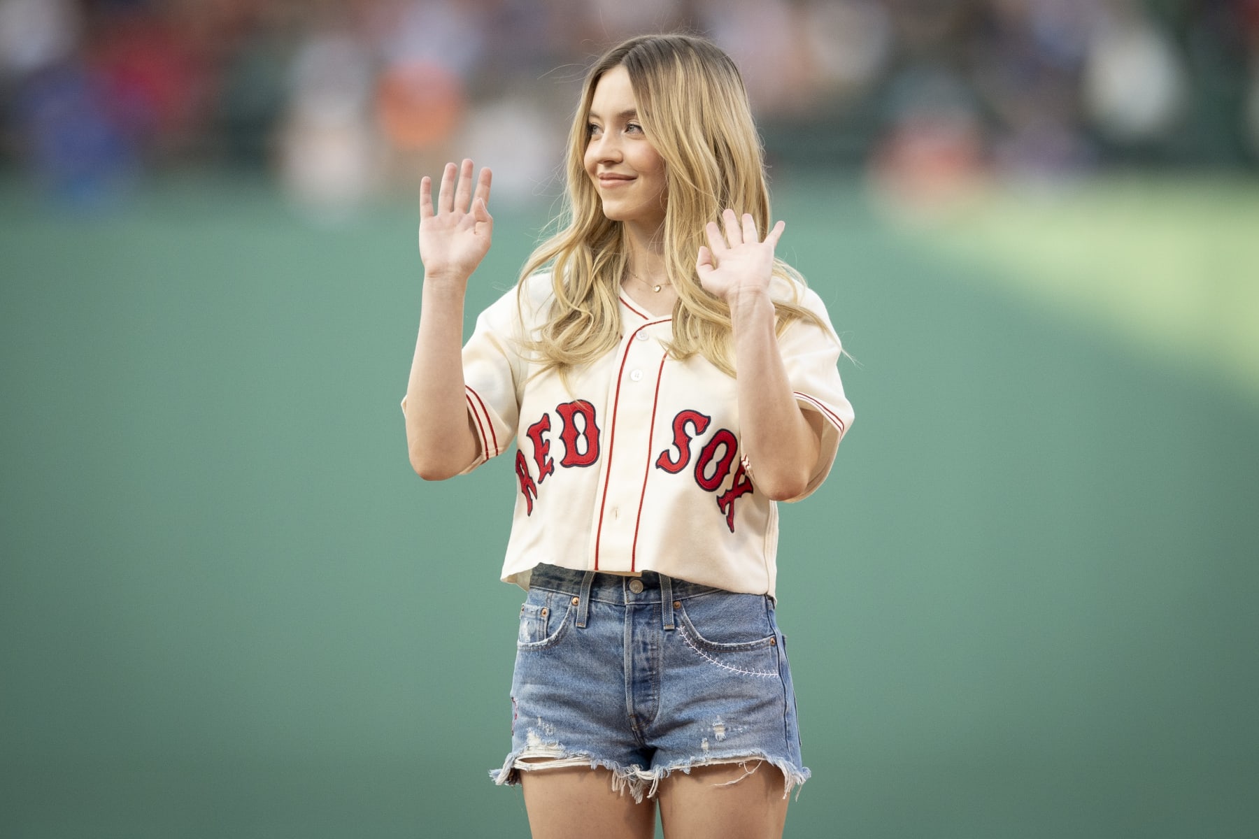 BOSTON, MA - JULY 22: Sydney Sweeney throws a ceremonial first pitch ahead of a game between the Toronto Blue Jays and the Boston Red Sox on July 22, 2022 at Fenway Park in Boston, Massachusetts. (Photo by Maddie Malhotra/Boston Red Sox/Getty Images)