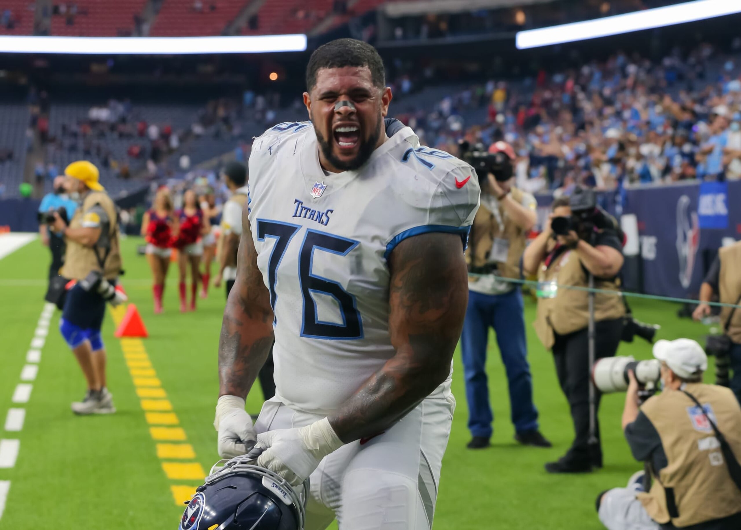 HOUSTON, TX - JANUARY 09:  Tennessee Titans guard Rodger Saffold III (76) hams it up for the camera during the NFL game between the Tennessee Titans and Houston Texans on January 9, 2022 at NRG Stadium in Houston, Texas.  (Photo by Leslie Plaza Johnson/Icon Sportswire via Getty Images)