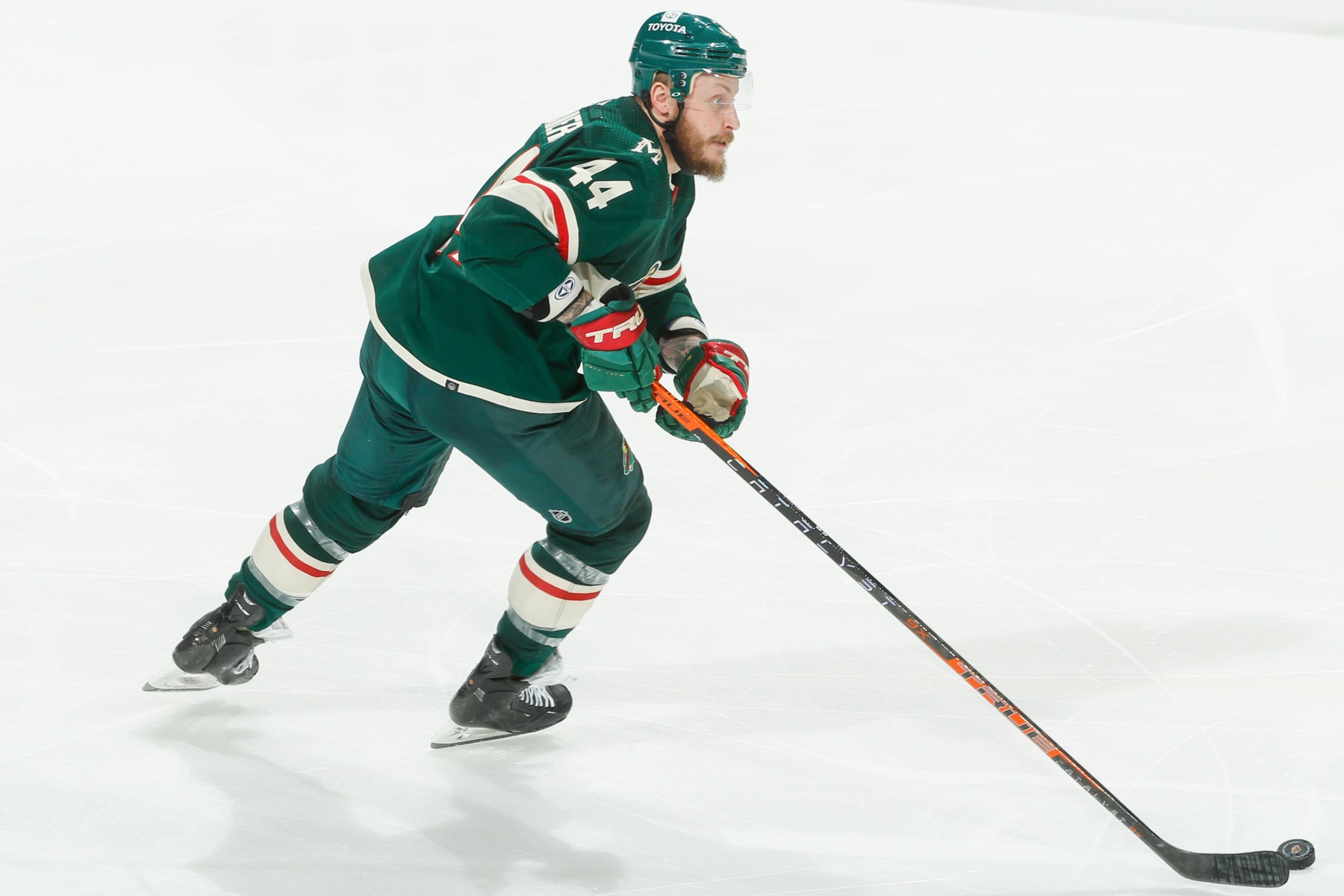 SAINT PAUL, MN - APRIL 17: Nicolas Deslauriers #44 of the Minnesota Wild skates with the puck against the San Jose Sharks during the game at the Xcel Energy Center on April 17, 2022 in Saint Paul, Minnesota. (Photo by Bruce Kluckhohn/NHLI via Getty Images)