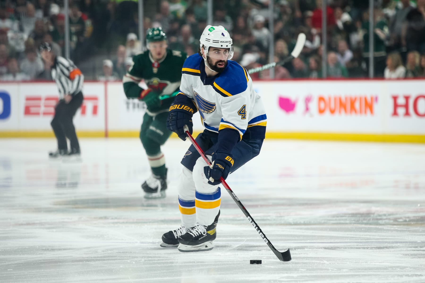 ST PAUL, MN - MAY 10: Nick Leddy #4 of the St. Louis Blues skates with the puck against the Minnesota Wild in the first period in Game Five of the First Round of the 2022 Stanley Cup Playoffs at Xcel Energy Center on May 10, 2022 in St Paul, Minnesota. (Photo by David Berding/Getty Images)