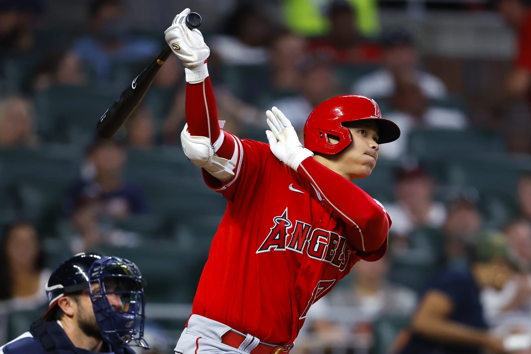ATLANTA, GA - JULY 23: Shohei Ohtani #17 of the Los Angeles Angels watches the ball as it goes deep for a home run during the fifth inning against the Atlanta Braves at Truist Park on July 23, 2022 in Atlanta, Georgia. (Photo by Todd Kirkland/Getty Images)
