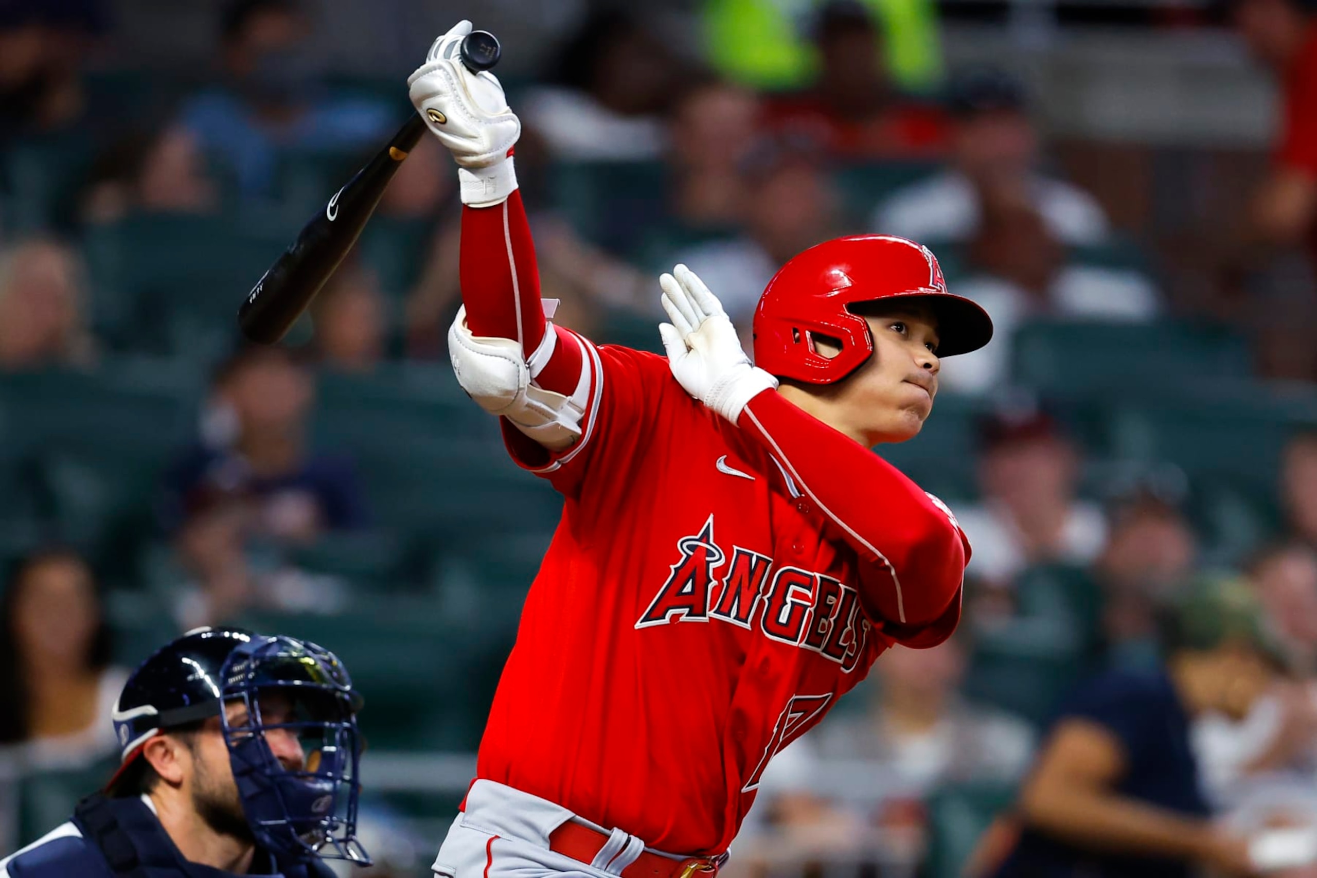ATLANTA, GA - JULY 23: Shohei Ohtani #17 of the Los Angeles Angels watches the ball as it goes deep for a home run during the fifth inning against the Atlanta Braves at Truist Park on July 23, 2022 in Atlanta, Georgia. (Photo by Todd Kirkland/Getty Images)