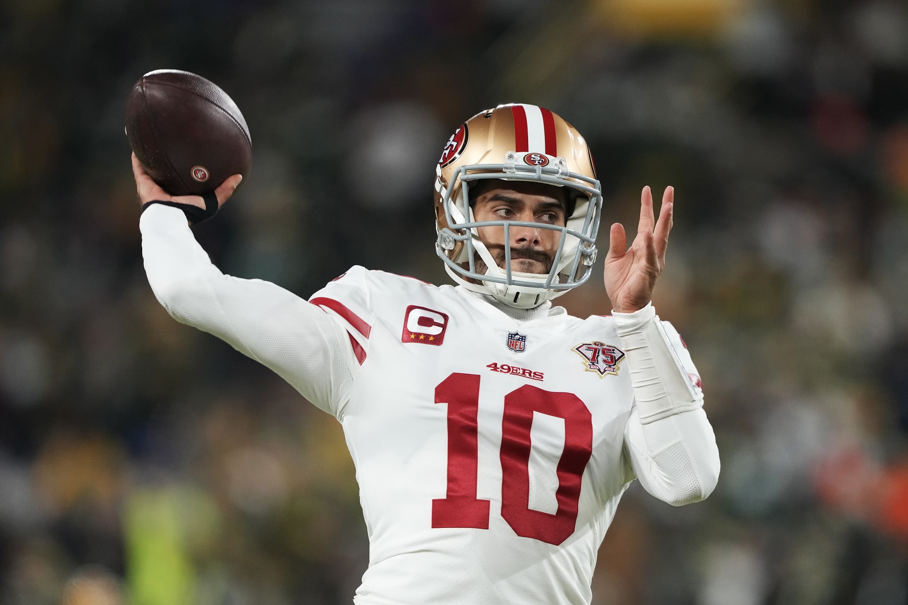 GREEN BAY, WISCONSIN - JANUARY 22:  Quarterback Jimmy Garoppolo #10 of the San Francisco 49ers warms up prior to the  NFC Divisional Playoff game against the Green Bay Packers at Lambeau Field on January 22, 2022 in Green Bay, Wisconsin. (Photo by Patrick McDermott/Getty Images)