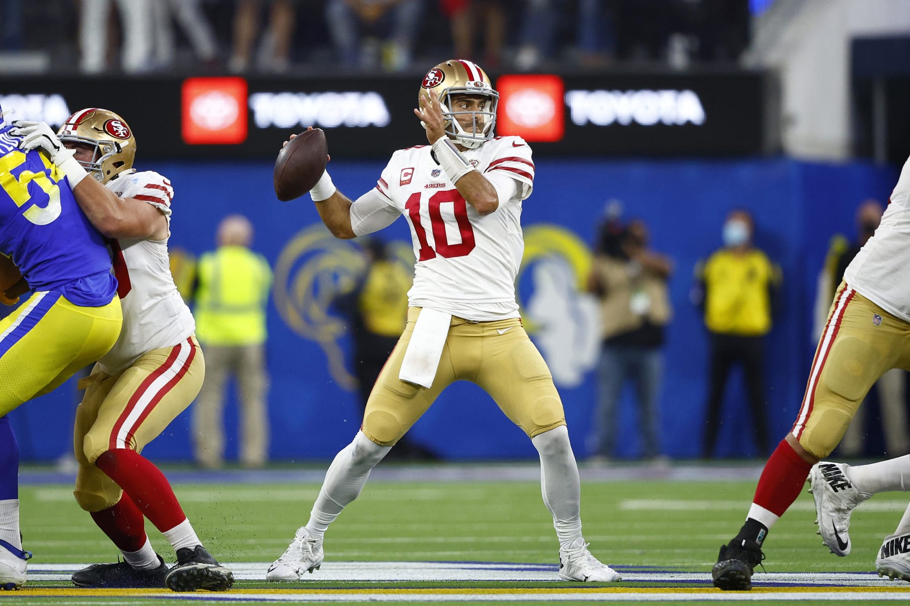 INGLEWOOD, CALIFORNIA - JANUARY 30: Jimmy Garoppolo #10 of the San Francisco 49ers looks to pass in the third quarter against the Los Angeles Rams in the NFC Championship Game at SoFi Stadium on January 30, 2022 in Inglewood, California. (Photo by Ronald Martinez/Getty Images)