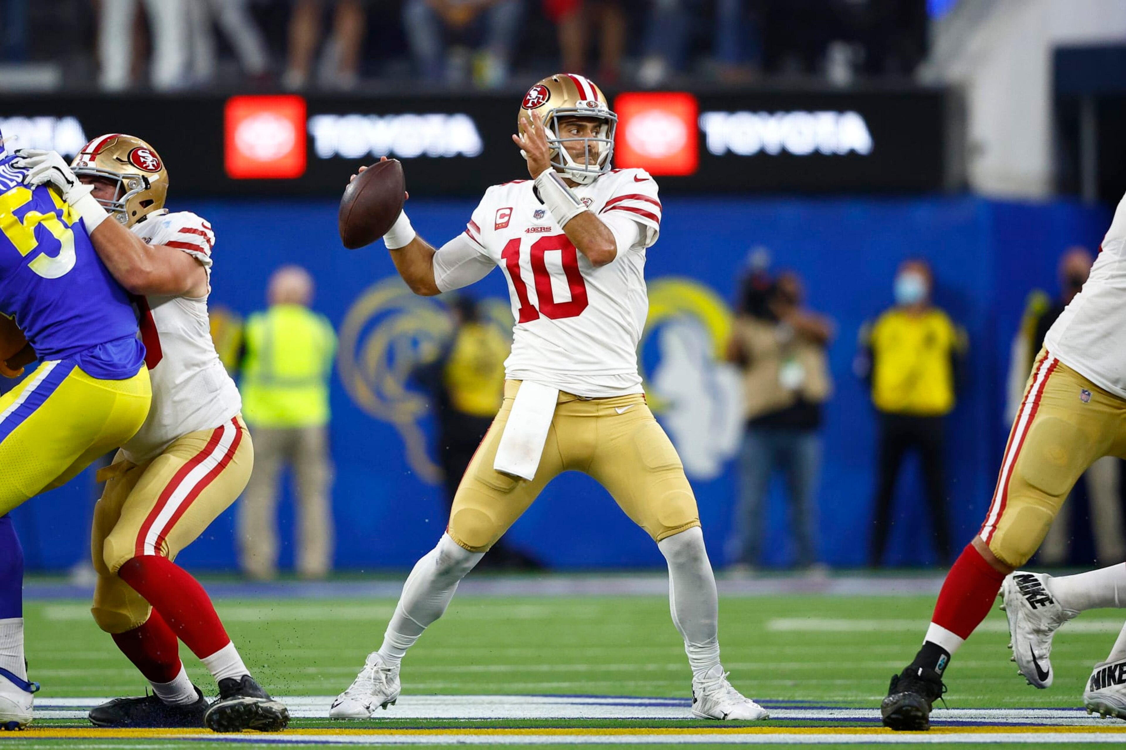INGLEWOOD, CALIFORNIA - JANUARY 30: Jimmy Garoppolo #10 of the San Francisco 49ers looks to pass in the third quarter against the Los Angeles Rams in the NFC Championship Game at SoFi Stadium on January 30, 2022 in Inglewood, California. (Photo by Ronald Martinez/Getty Images)
