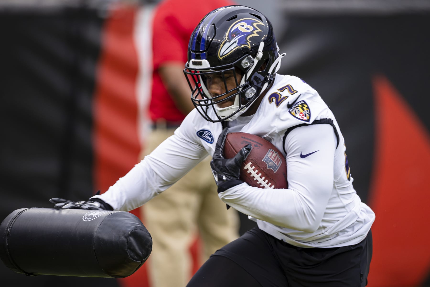 BALTIMORE, MD - JULY 31: J.K. Dobbins #27 of the Baltimore Ravens participates in a drill during training camp at M&T Bank Stadium on July 31, 2021 in Baltimore, Maryland. (Photo by Scott Taetsch/Getty Images)