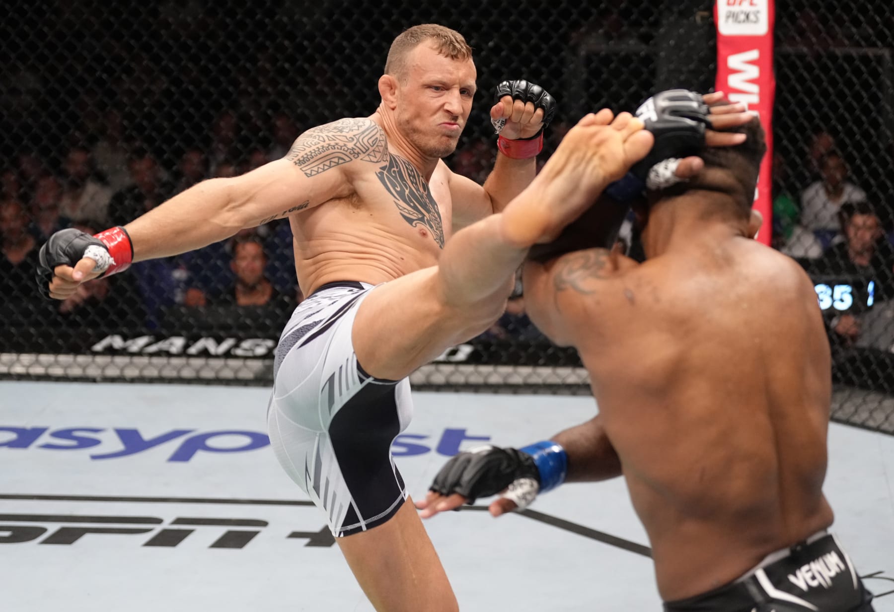 LONDON, ENGLAND - JULY 23: (L-R) Jack Hermansson of Sweden kicks Chris Curtis in a middleweight fight during the UFC Fight Night event at O2 Arena on July 23, 2022 in London, England. (Photo by Jeff Bottari/Zuffa LLC)