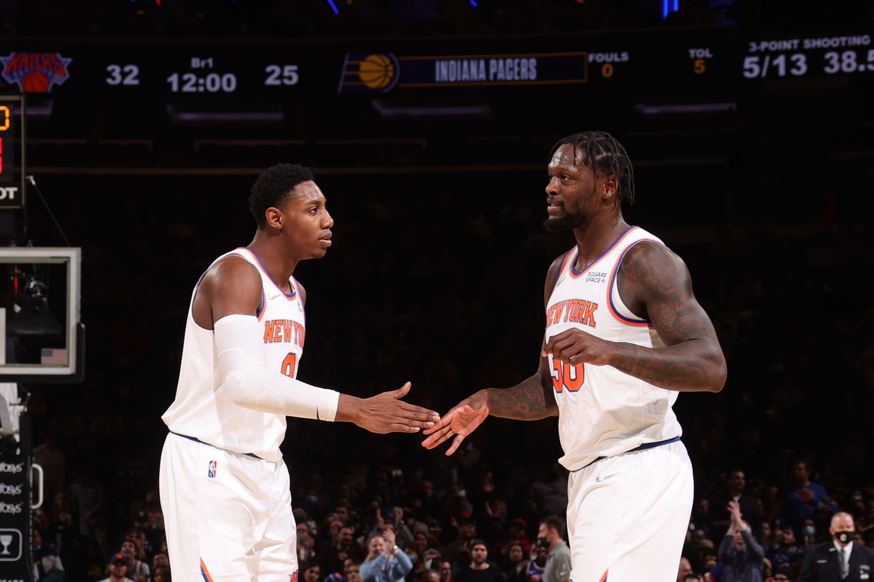NEW YORK, NY - JANUARY 4: RJ Barrett #9 hi-fives Julius Randle #30 of the New York Knicks during the game against the Indiana Pacers on January 4, 2022 at Madison Square Garden in New York City, New York.  NOTE TO USER: User expressly acknowledges and agrees that, by downloading and or using this photograph, User is consenting to the terms and conditions of the Getty Images License Agreement. Mandatory Copyright Notice: Copyright 2022 NBAE  (Photo by Nathaniel S. Butler/NBAE via Getty Images)