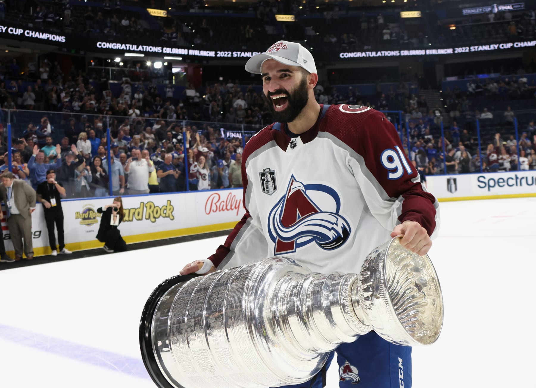 TAMPA, FLORIDA - JUNE 26: Nazem Kadri #91 of the Colorado Avalanche carries the Stanley Cup following the series winning victory over the Tampa Bay Lightning in Game Six of the 2022 NHL Stanley Cup Final at Amalie Arena on June 26, 2022 in Tampa, Florida. (Photo by Bruce Bennett/Getty Images)