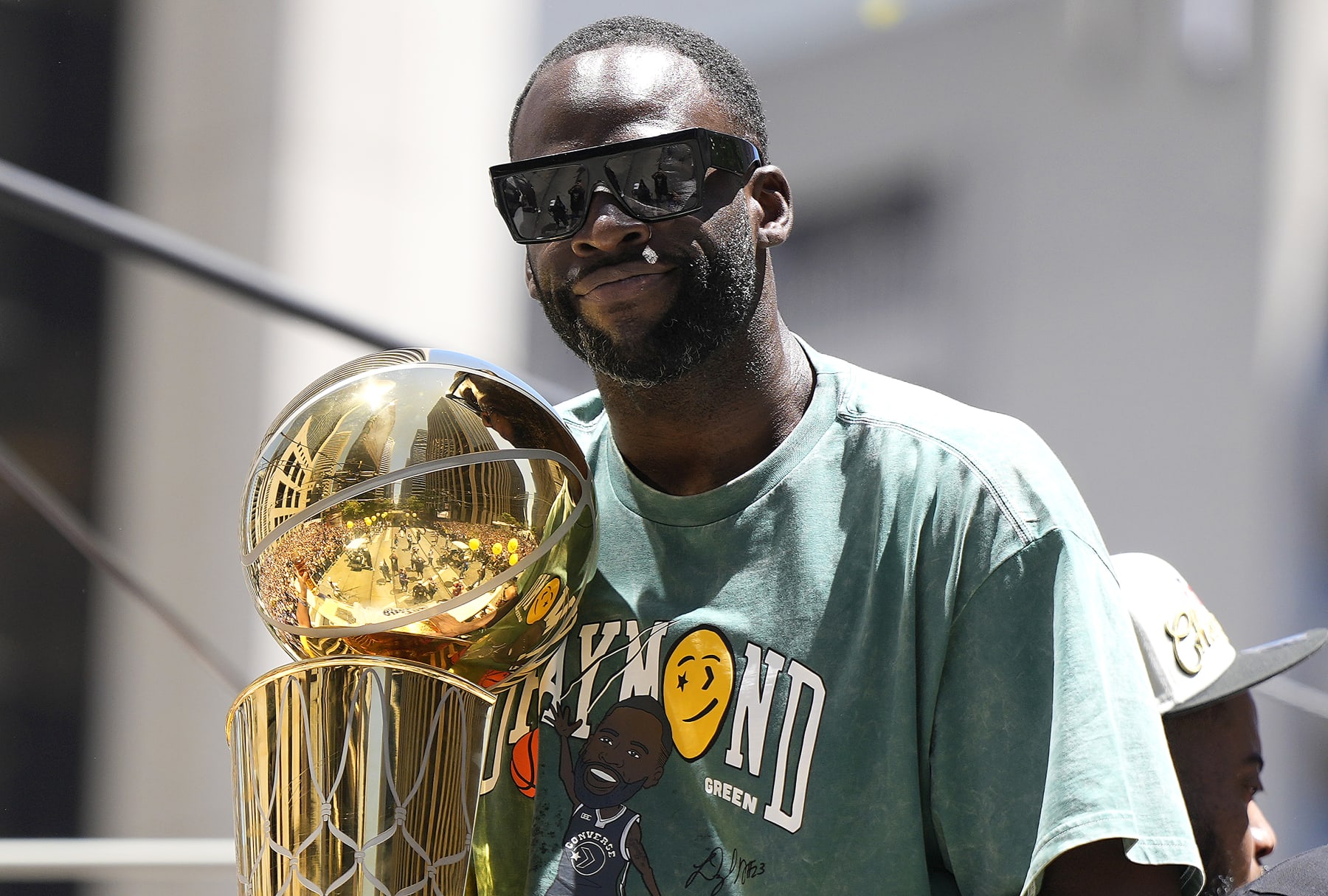 SAN FRANCISCO, CALIFORNIA - JUNE 20: Draymond Green #23 of the Golden State Warriors celebrates with the NBA Championship Trophy during the Golden State Warriors Victory Parade on June 20, 2022 in San Francisco, California. The Golden State Warriors beat the Boston Celtics 4-2 to win the 2022 NBA Finals. NOTE TO USER: User expressly acknowledges and agrees that, by downloading and or using this photograph, User is consenting to the terms and conditions of the Getty Images License Agreement. (Photo by Thearon W. Henderson/Getty Images)(Photo by Thearon W. Henderson/Getty Images)