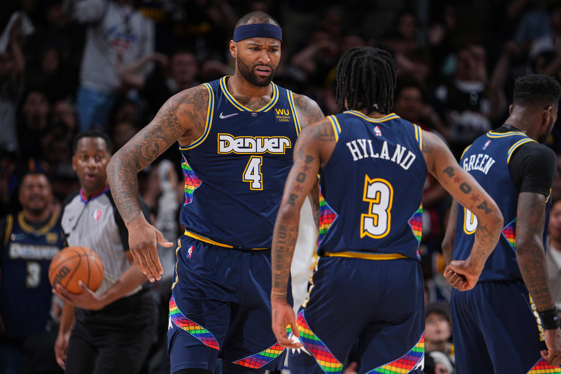 DENVER, CO - APRIL 24: Bones Hyland #3 and DeMarcus Cousins #4 of the Denver Nuggets celebrate against the Golden State Warriors during Round 1 Game 4 of the 2022 NBA Playoffs on April 24, 2022 at the Ball Arena in Denver, Colorado. NOTE TO USER: User expressly acknowledges and agrees that, by downloading and/or using this Photograph, user is consenting to the terms and conditions of the Getty Images License Agreement. Mandatory Copyright Notice: Copyright 2022 NBAE (Photo by Bart Young/NBAE via Getty Images)