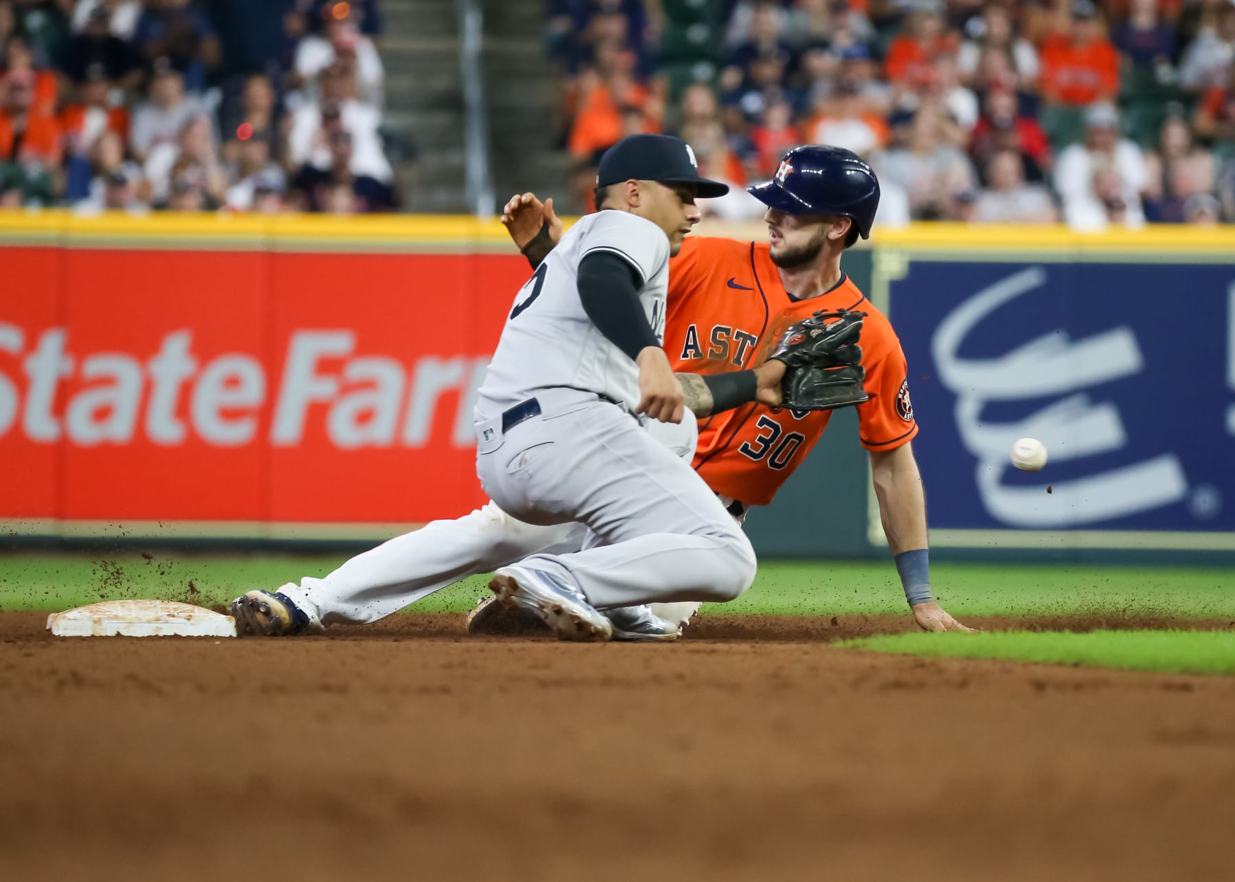 HOUSTON, TX - JULY 21:  New York Yankees second baseman Gleyber Torres (25) fails to tag Houston Astros right fielder Kyle Tucker (30), who stole second base in the bottom of the seventh inning during the MLB doubleheader Game 2 between the New York Yankees and Houston Astros on July 21, 2022 at Minute Maid Park in Houston, Texas.  (Photo by Leslie Plaza Johnson/Icon Sportswire via Getty Images)