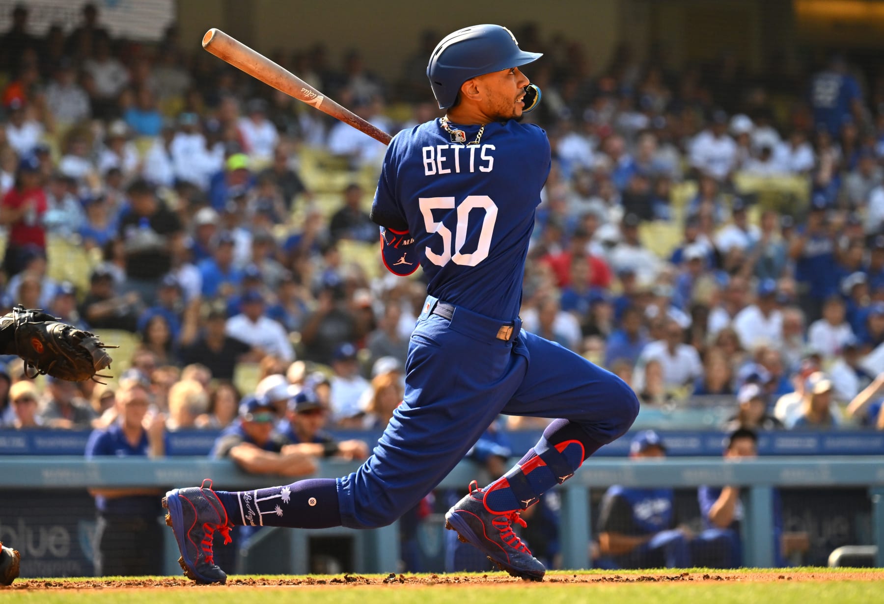 LOS ANGELES, CA - JULY 23: Mookie Betts #50 of the Los Angeles Dodgers hits a single in the first inning against the San Francisco Giants at Dodger Stadium on July 23, 2022 in Los Angeles, California. (Photo by Jayne Kamin-Oncea/Getty Images)