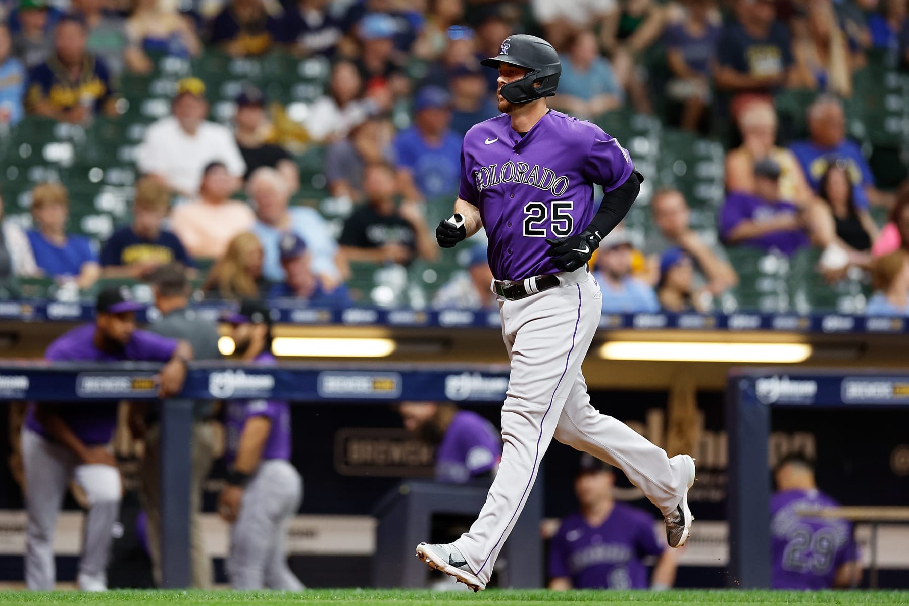MILWAUKEE, WISCONSIN - JULY 23: C.J. Cron #25 of the Colorado Rockies hits a solo home run in the ninth inning against the Milwaukee Brewers at American Family Field on July 23, 2022 in Milwaukee, Wisconsin. (Photo by John Fisher/Getty Images)