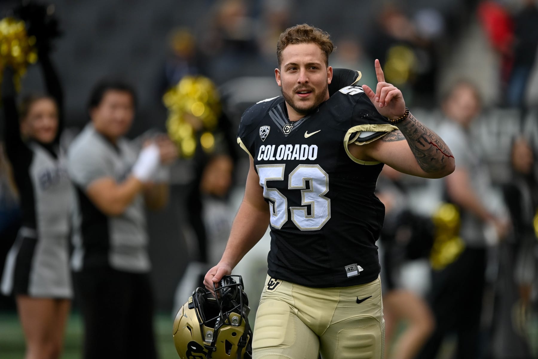 BOULDER, CO - NOVEMBER 20:  Linebacker Nate Landman #53 of the Colorado Buffaloes runs onto the field during a ceremony to honor graduating seniors before a game against the Washington Huskies at Folsom Field on November 20, 2021 in Boulder, Colorado. (Photo by Dustin Bradford/Getty Images)