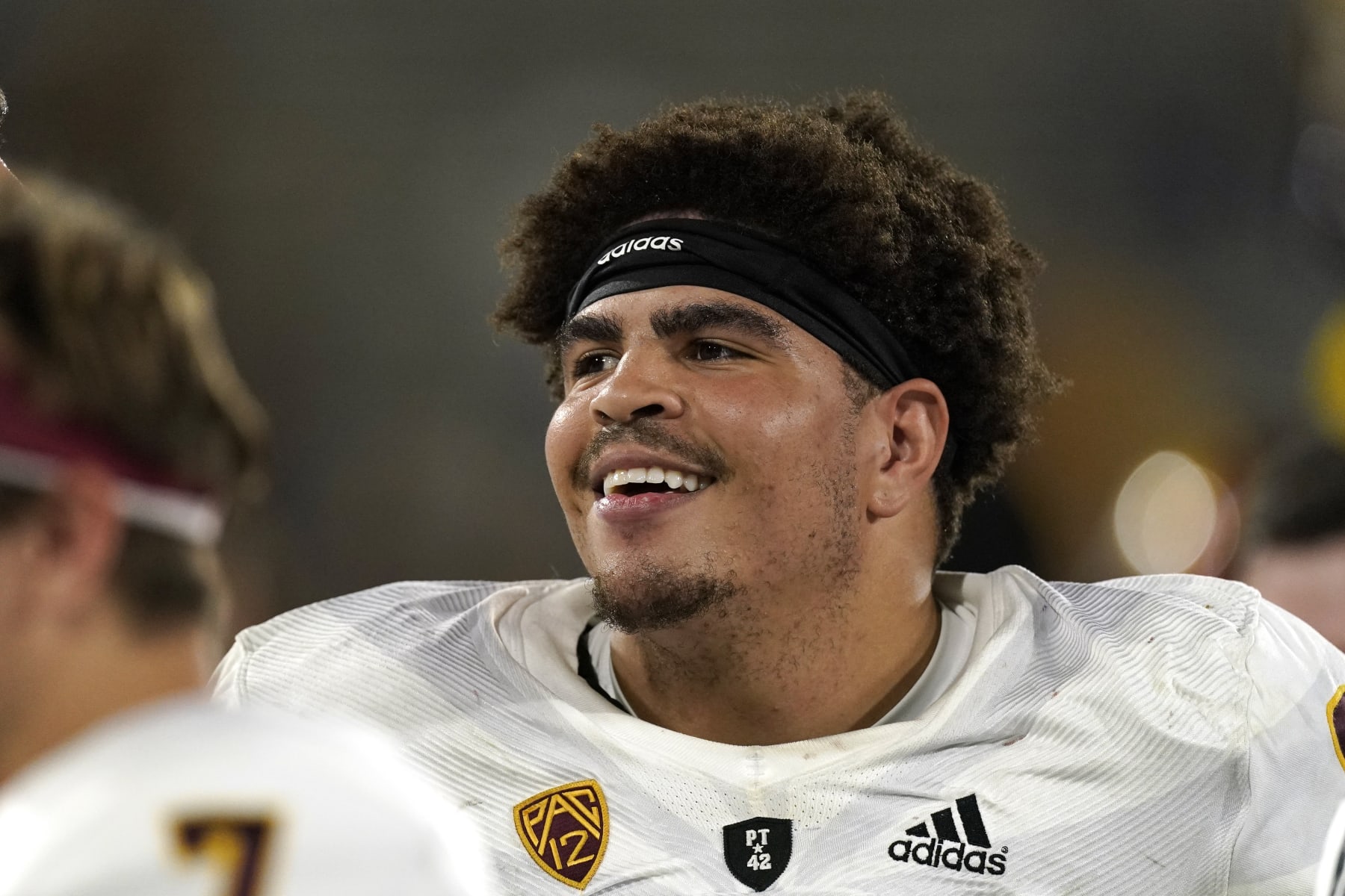 Arizona State offensive lineman Dohnovan West smiles from the sideline during the second half of an NCAA college football game against UCLA Saturday, Oct. 2, 2021, in Pasadena, Calif. Arizona State won 42-23. (AP Photo/Mark J. Terrill)