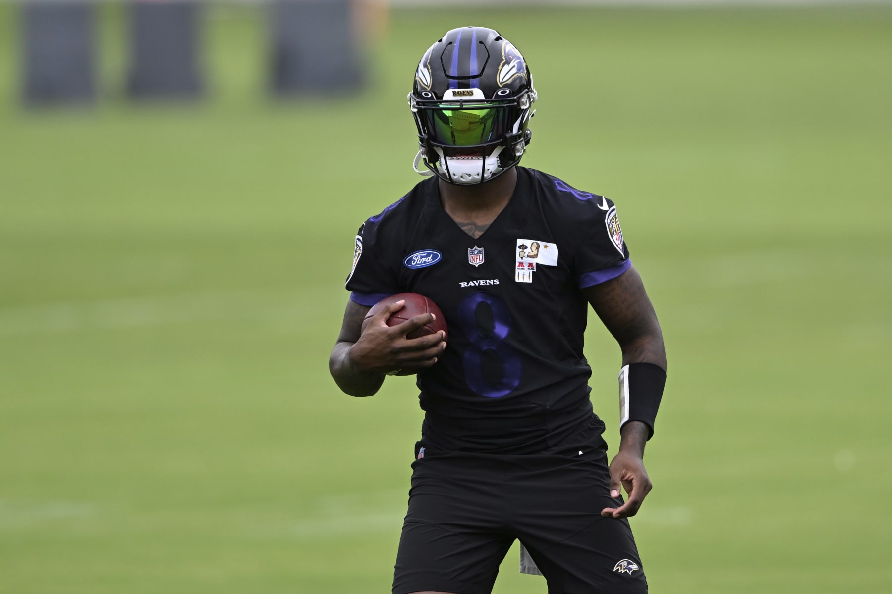 Baltimore Ravens quarterback Lamar Jackson takes part in drills at the NFL football team's practice facility, Thursday, June 16, 2022, in Owings Mills, Md. (AP Photo/Gail Burton)