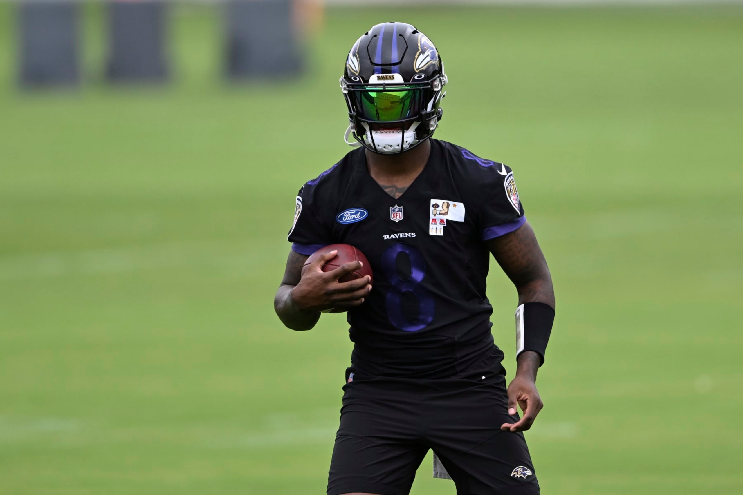 Baltimore Ravens quarterback Lamar Jackson takes part in drills at the NFL football team's practice facility, Thursday, June 16, 2022, in Owings Mills, Md. (AP Photo/Gail Burton)