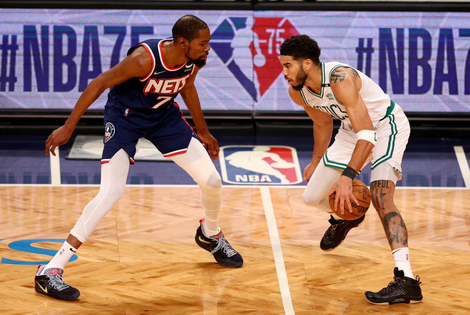 NEW YORK, NEW YORK - APRIL 25: Kevin Durant #7 of the Brooklyn Nets and Jayson Tatum #0 of the Boston Celtics square off during the first quarter of Game Four of the Eastern Conference First Round Playoffs against the Boston Celtics at Barclays Center on April 25, 2022 in the Brooklyn borough of New York City. NOTE TO USER: User expressly acknowledges and agrees that, by downloading and or using this photograph, User is consenting to the terms and conditions of the Getty Images License Agreement. (Photo by Elsa/Getty Images)
