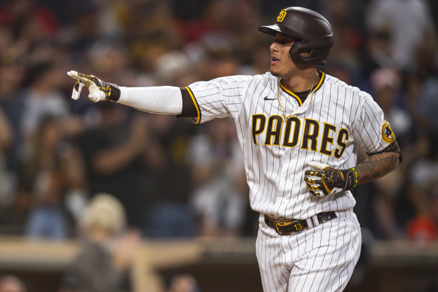 SAN DIEGO, CA - JULY 7: Manny Machado #13 of the San Diego Padres celebrates after hitting a home run in the fourth inning against the San Francisco Giants  on July 7, 2022 at Petco Park in San Diego, California. (Photo by Matt Thomas/San Diego Padres/Getty Images)