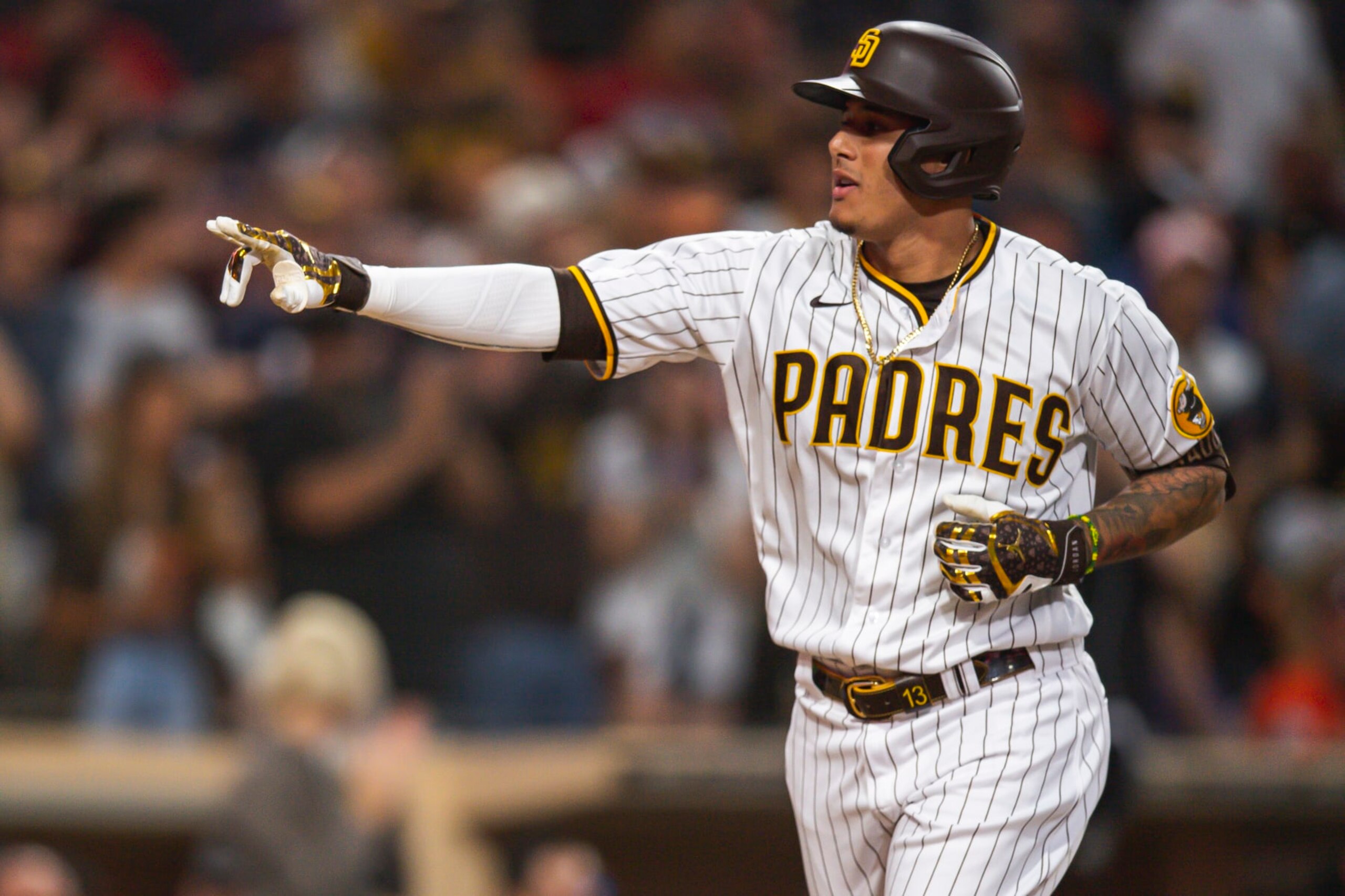 SAN DIEGO, CA - JULY 7: Manny Machado #13 of the San Diego Padres celebrates after hitting a home run in the fourth inning against the San Francisco Giants  on July 7, 2022 at Petco Park in San Diego, California. (Photo by Matt Thomas/San Diego Padres/Getty Images)