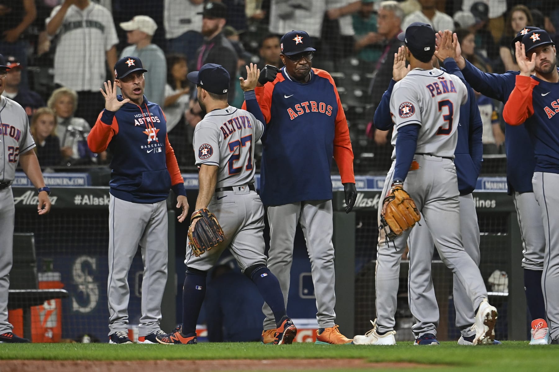 SEATTLE, WASHINGTON - JULY 22: Dusty Baker Jr. #12 of the Houston Astros high fives Jose Altuve #27 after the game against the Seattle Mariners at T-Mobile Park on July 22, 2022 in Seattle, Washington. The Houston Astros won 5-2. (Photo by Alika Jenner/Getty Images)