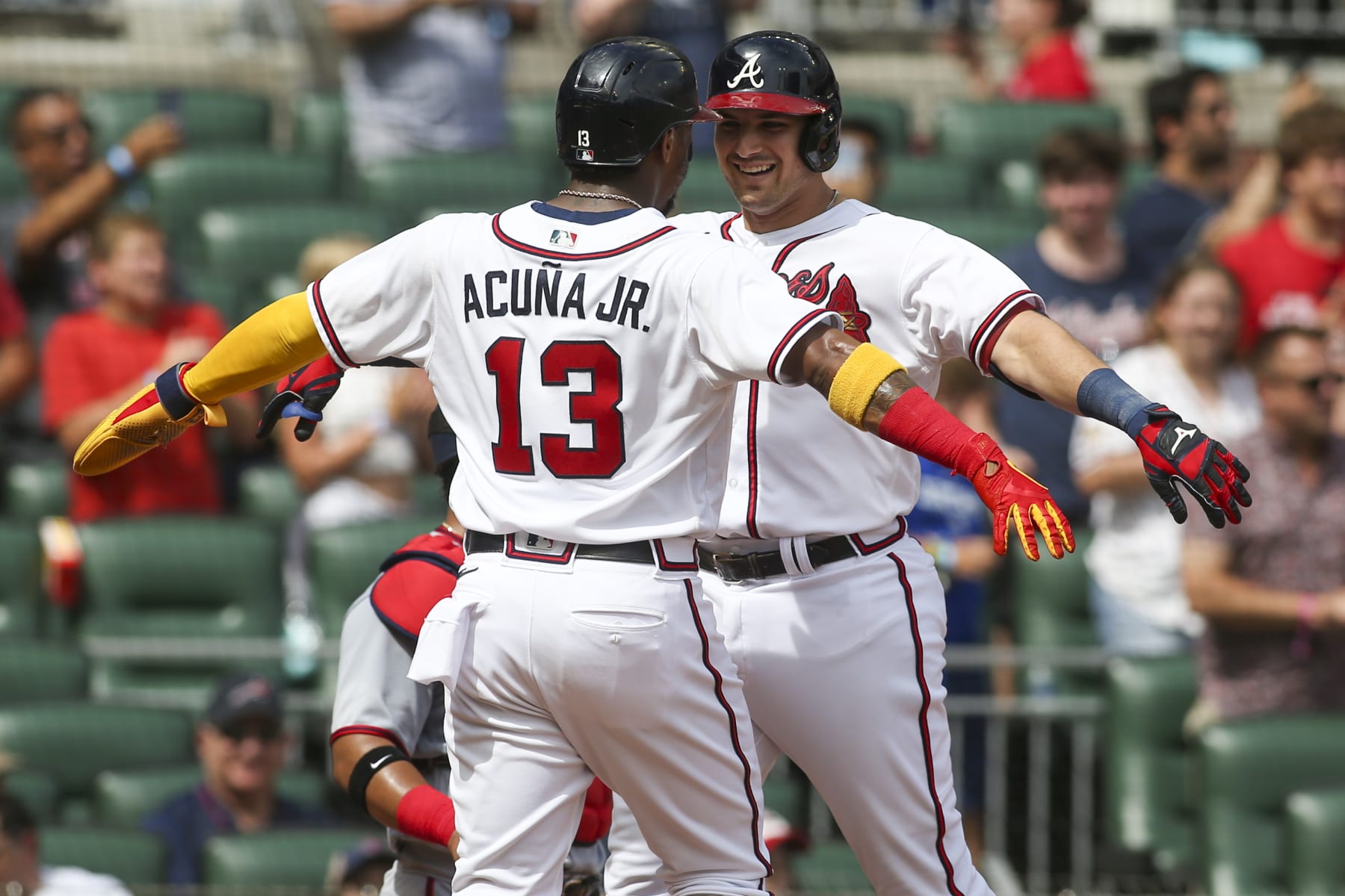 ATLANTA, GA - JULY 09: Austin Riley #27 celebrates with Ronald Acuna Jr. #13 of the Atlanta Braves after a two-run home run against the Washington Nationals in the first inning at Truist Park on July 9, 2022 in Atlanta, Georgia. (Photo by Brett Davis/Getty Images)